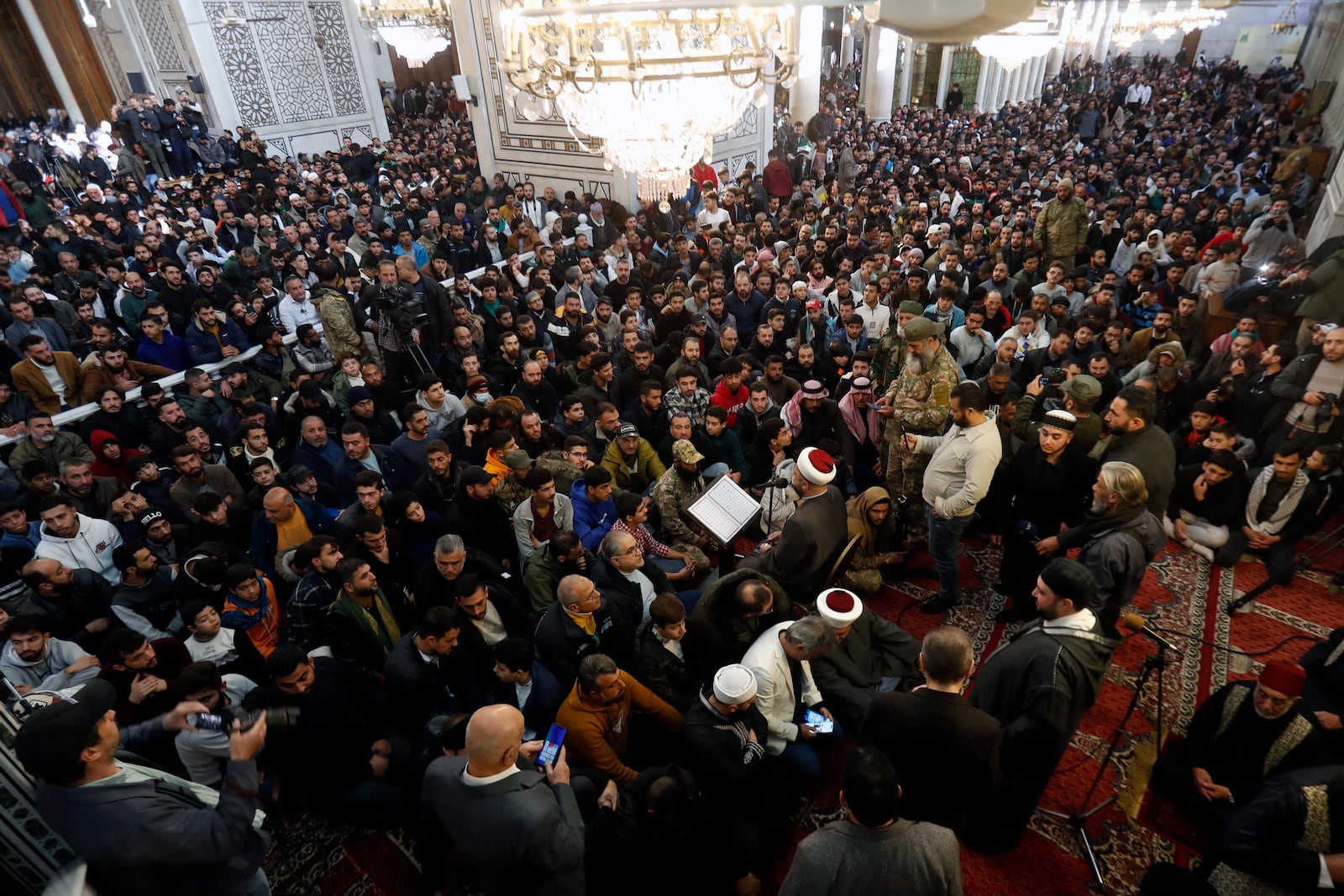 Syrians attend Friday prayers inside the 7th century Umayyad Mosque in Damascus, Syria, Friday, Dec. 13, 2024. (AP Photo/Omar Sanadiki)