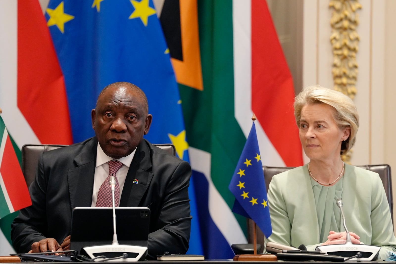 South Africa's President Cyril Ramaphosa, left, speaks as Ursula von der Leyen, the European Commission President looks on during the opening remarks for the eighth EU-South Africa summit in Cape Town, South Africa, Thursday, March 13, 2025. (AP Photo/Nardus Engelbrecht)