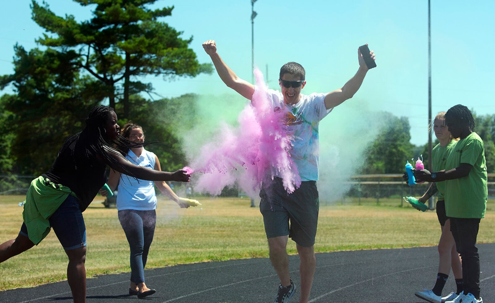 A runner moves through an explosion of color as he takes part in Colorfest on June 30 at Wright-Patterson Air Force Base’s Jarvis track. Colorfest, presented by the 88th Force Support Squadron, celebrated diversity, inclusivity and a sense of community. U.S. AIR FORCE PHOTO/R.J. ORIEZ