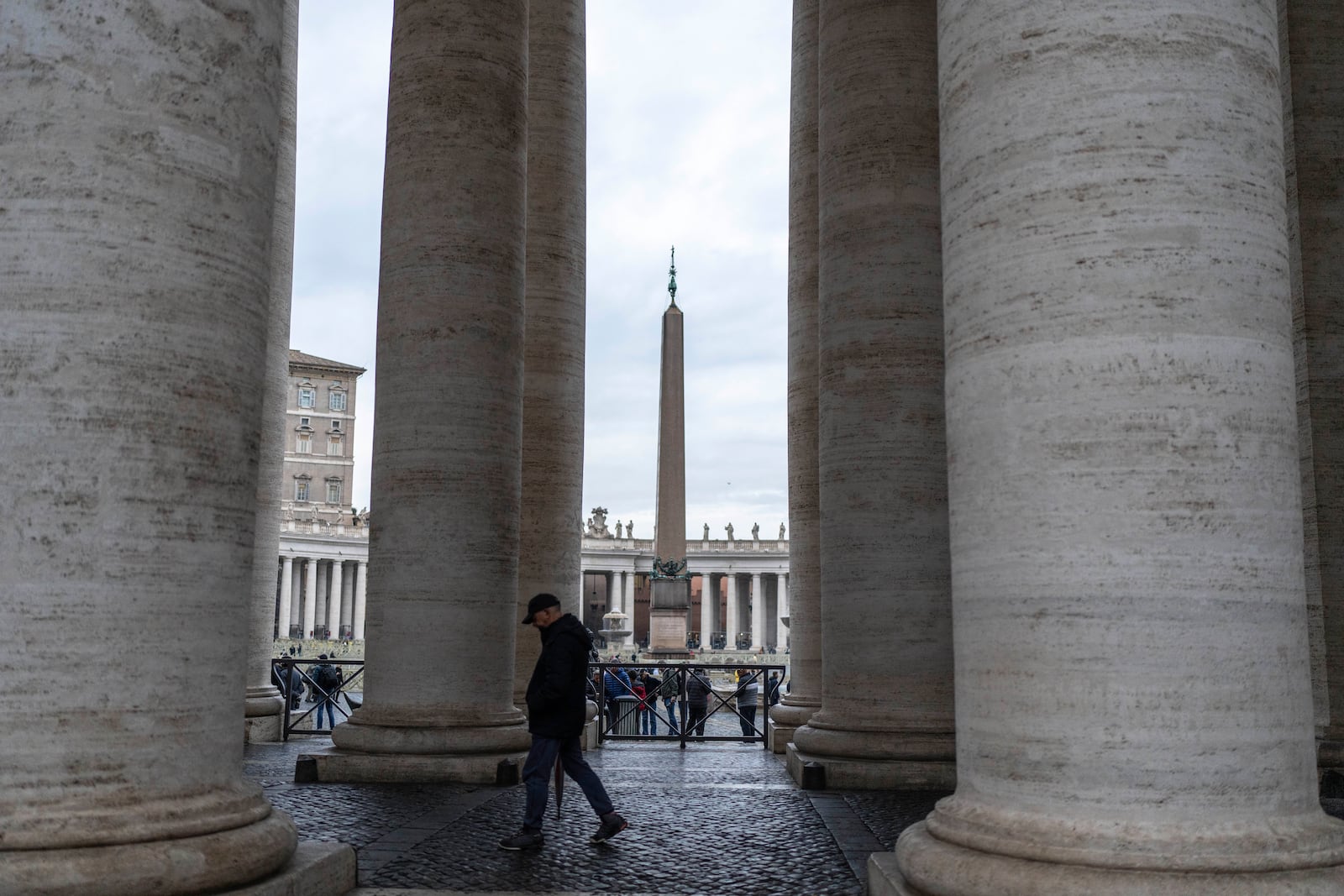 A man walks in St. Peter's square at The Vatican, Monday, Feb. 24, 2025. (AP Photo/Mosa'ab Elshamy)