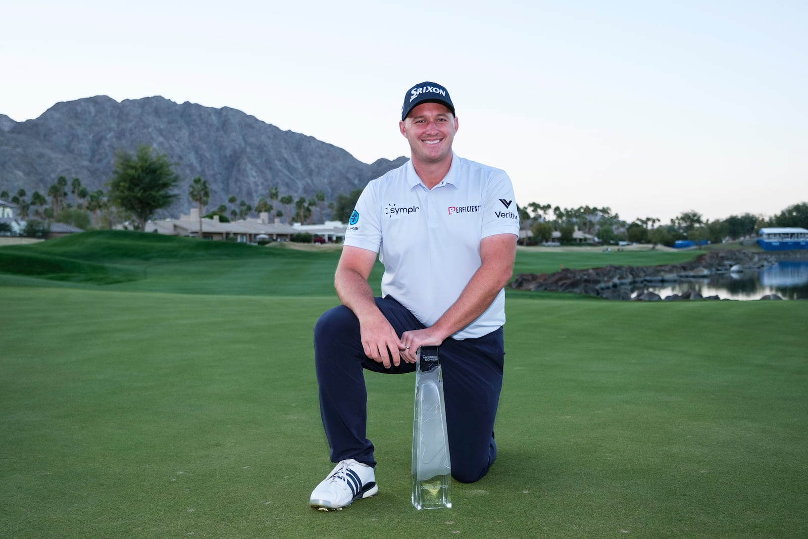 Sepp Straka poses with the trophy after winning the American Express golf tournament in La Quinta, Calif., Sunday, Jan. 19, 2025. (AP Photo/William Liang)