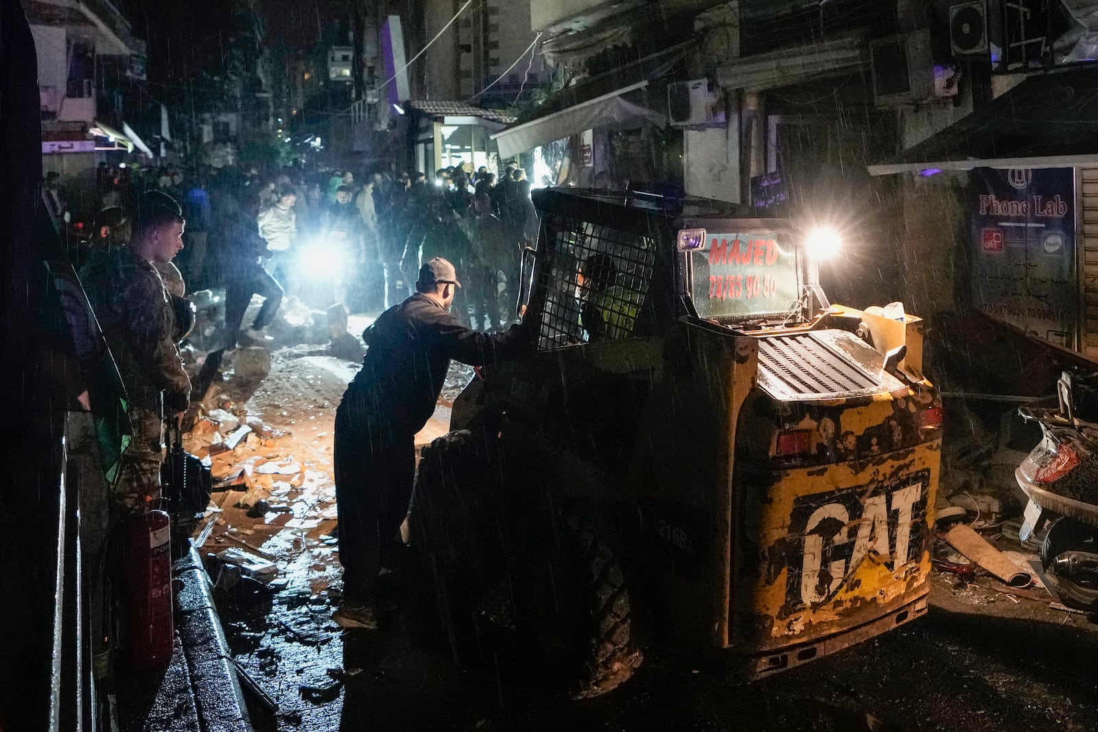 Rescue workers work at the site of an Israeli airstrike in Beirut, Lebanon, Monday, Nov. 18, 2024. (AP Photo/Bilal Hussein)