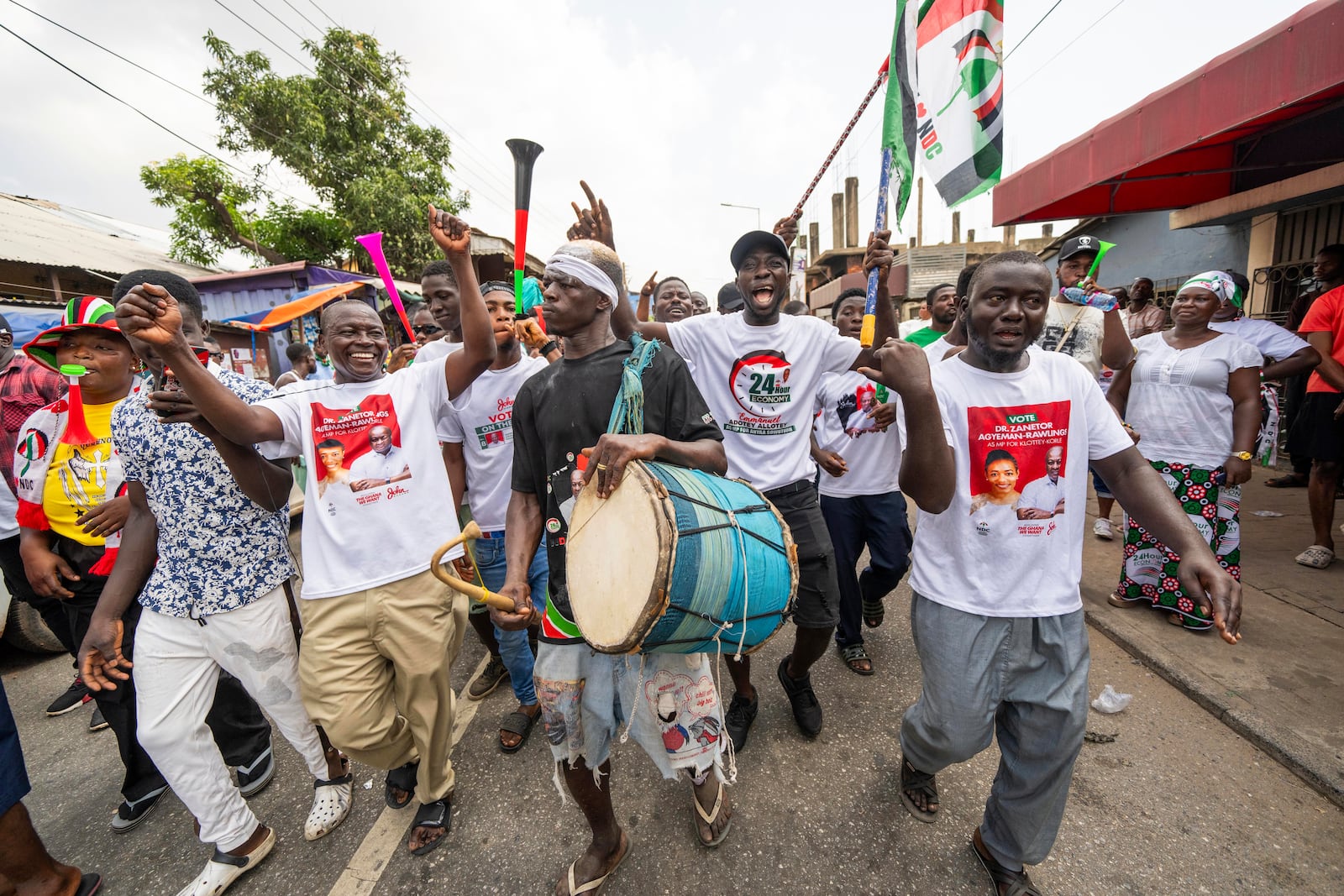 Supporters of opposition candidate and former President John Dramani Mahama celebrate his victory after his opponent Ghana’s vice president and ruling party candidate, Mahamudu Bawumia conceded in Accra, Ghana, Sunday, Dec. 8, 2024. (AP Photo/Jerome Delay)