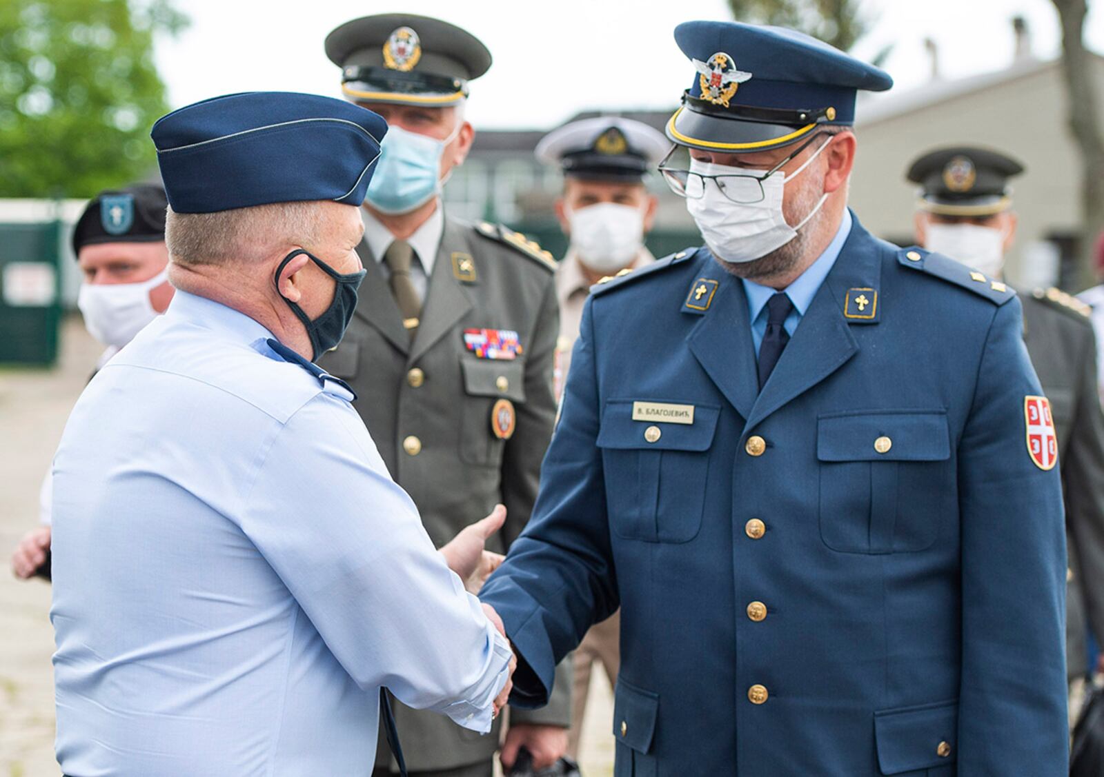 Serbian Armed Forces Lt. Vladimir Blagojevic, Serbian Air Force orthodox chaplain, is greeted by Col. Kim Bowen, wing chaplain for the 88th Air Base Wing, upon his arrival to the Prairies Chapel at Wright-Patterson Air Force Base May 11. U.S. AIR FORCE PHOTO/WESLEY FARNSWORTH