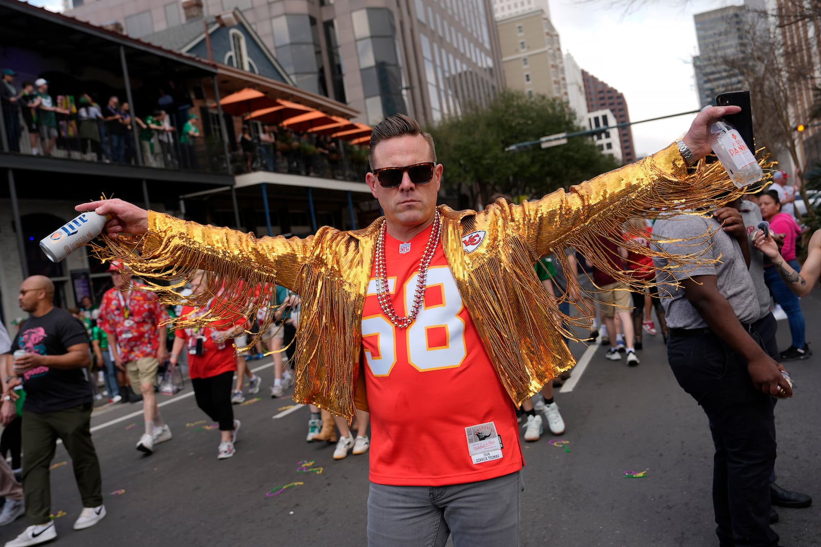 A Kansas City Chiefs fan walks near the Caesars Superdome before the NFL Super Bowl 59 football game between the Chiefs and the Philadelphia Eagles, Sunday, Feb. 9, 2025, in New Orleans. (AP Photo/Julia Demaree Nikhinson)