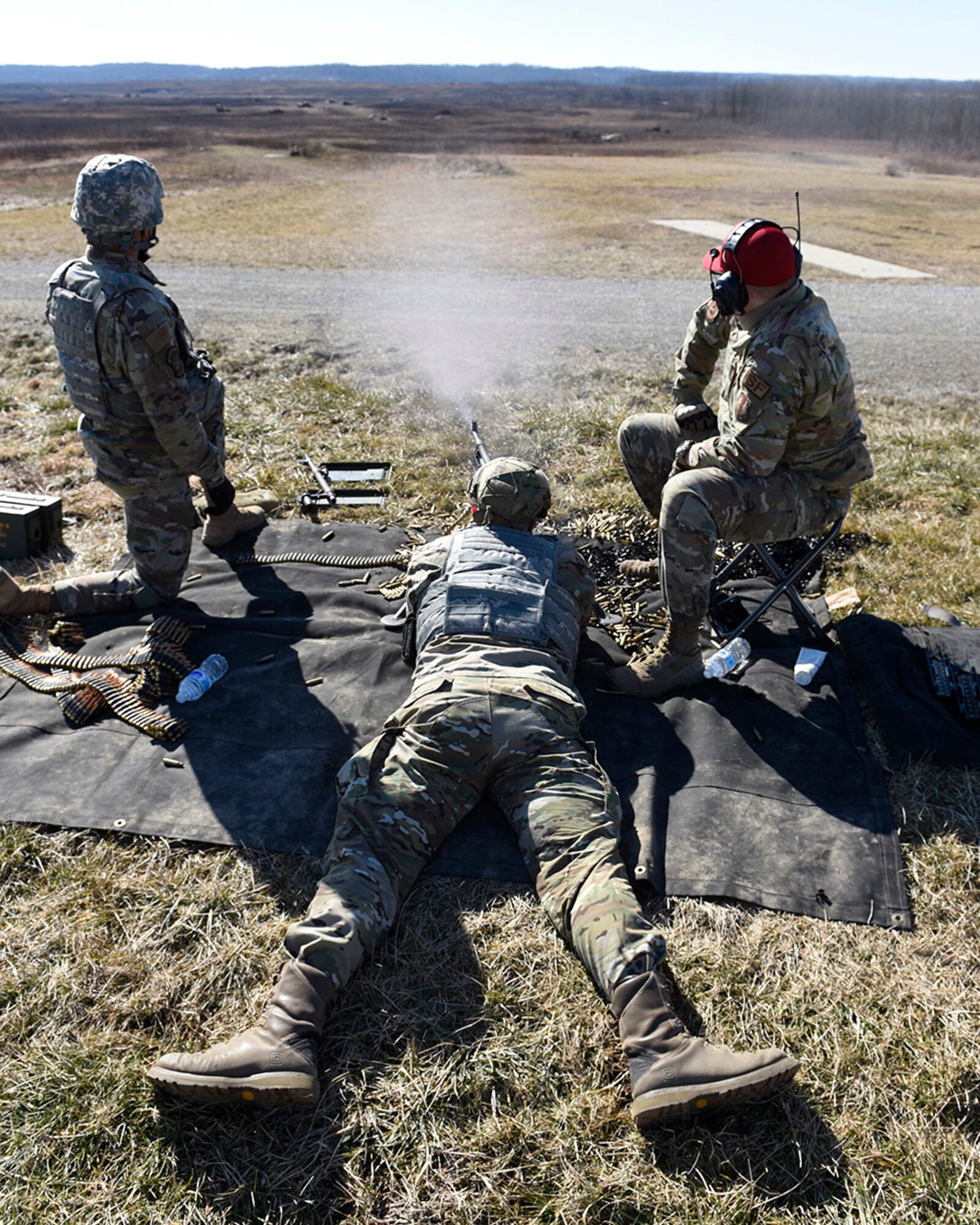 Airman 1st Class Aaron Edge, of the 88th Security Forces Squadron at Wright-Patterson Air Force Base, fires an M240B machine gun at Camp Atterbury, Indiana, on Feb. 25. U.S. AIR FORCE PHOTO/TY GREENLEES