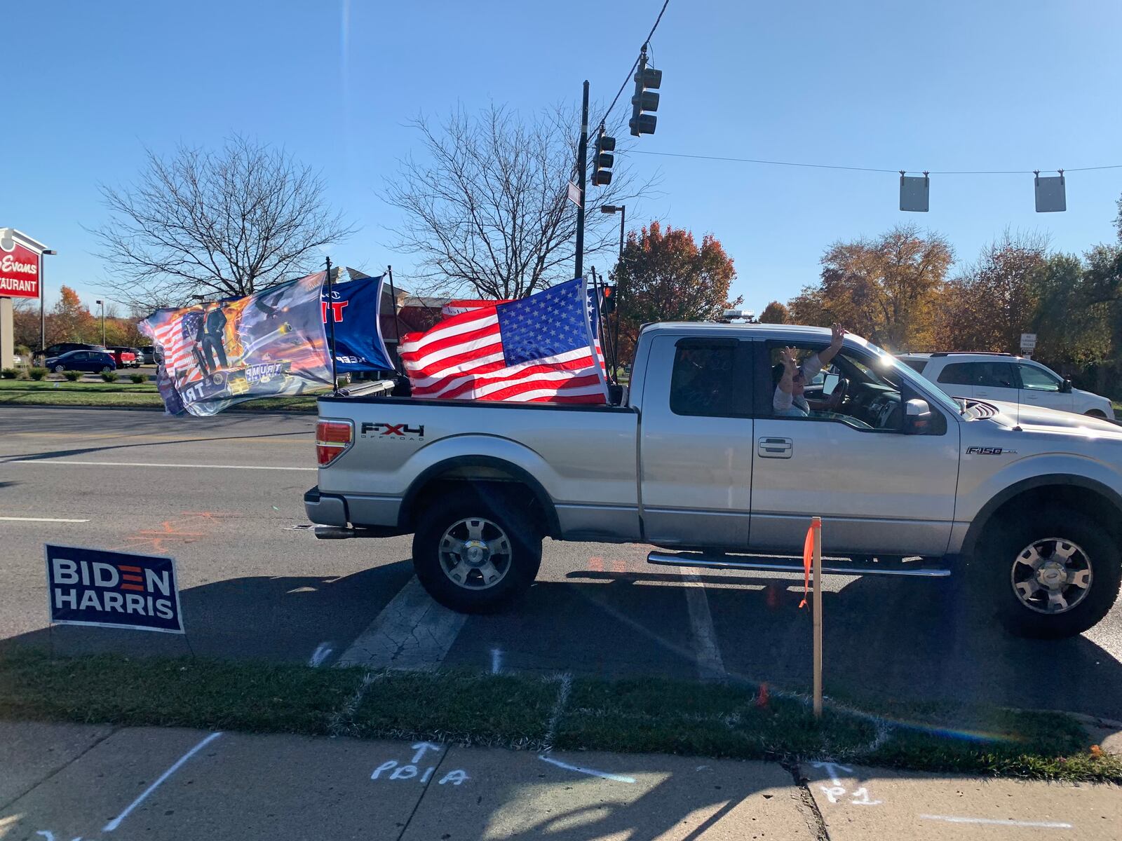 Supporters of President Donald Trump drive by a rally held by supporters of President-Elect Joe Biden on Sunday, Nov. 8. JOSH SWEIGART/STAFF.