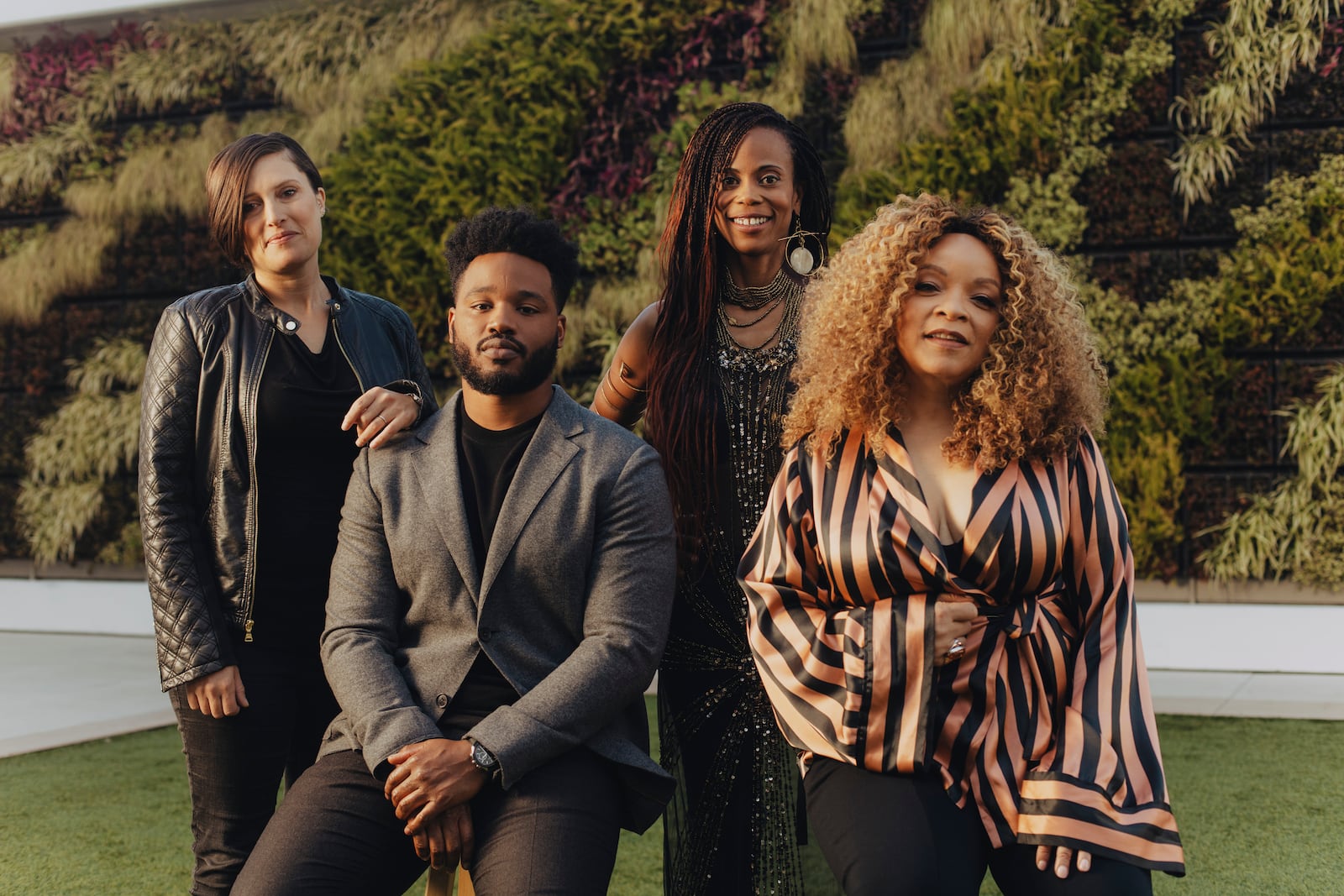 Ryan Coogler with some of his "Black Panther" department heads: from left, the cinematographer Rachel Morrison, the production designer Hannah Beachler, and the costume designer Ruth E. Carter in Beverly Hills, Calif., Nov. 3, 2018. The the crew of Black Panther is unusual among blockbusters for its large number of female department heads. (Rozette Rago/The New York Times)