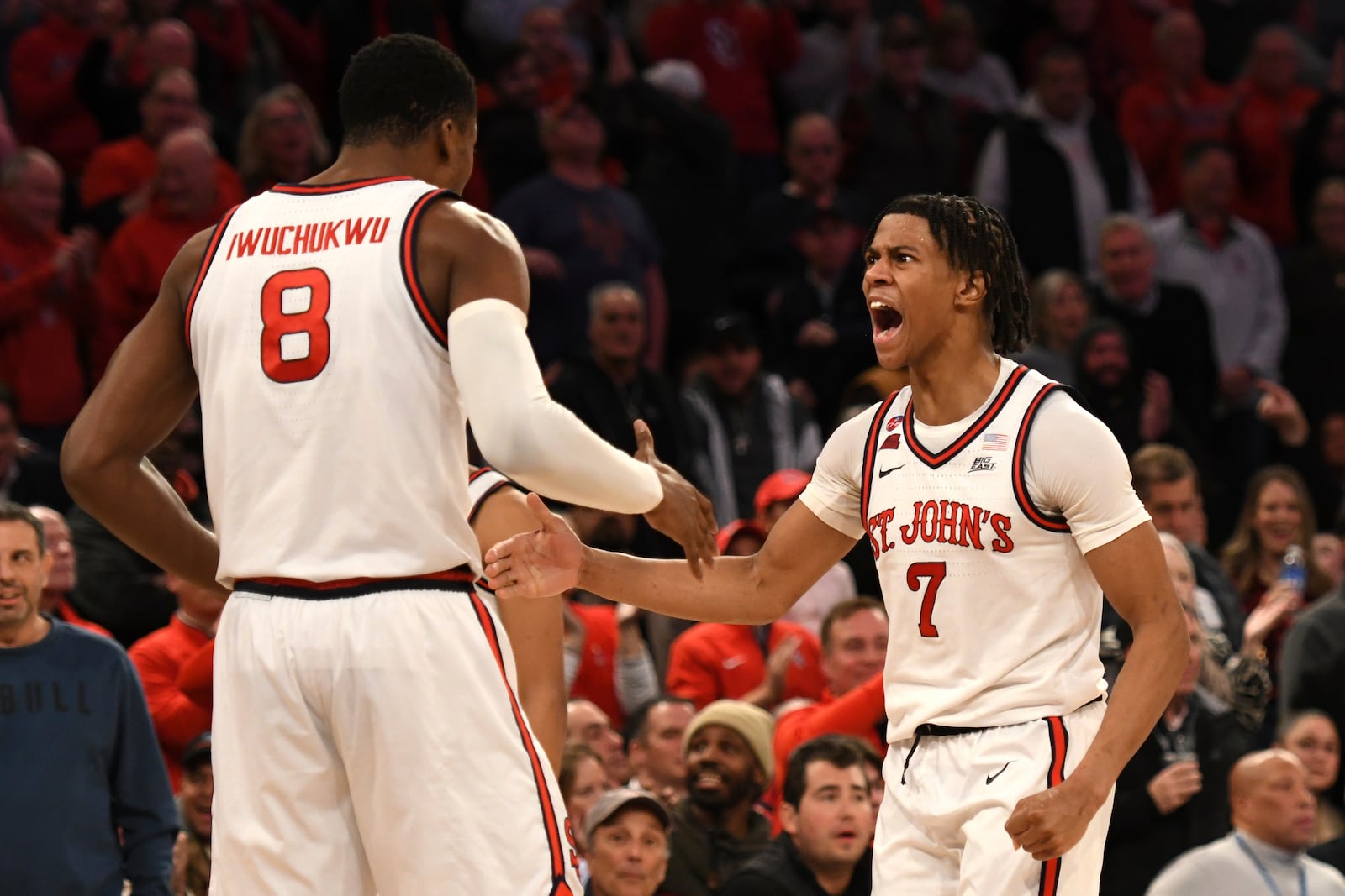 St. John's center Vince Iwuchukwu (8) and guard Simeon Wilcher (7) react as an NCAA college basketball game against Xavier goes into overtime Wednesday, Jan. 22, 2025, in New York. (AP Photo/Pamela Smith)