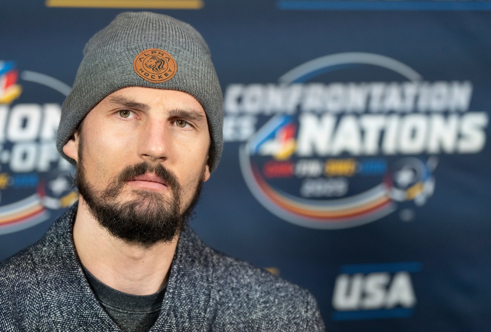 United States goaltender Connor Hellebuyck speaks with the media following a 4 Nations Face-Off hockey practice in Brossard, Quebec, Monday, Feb. 10, 2025. (Christinne Muschi/The Canadian Press via AP)