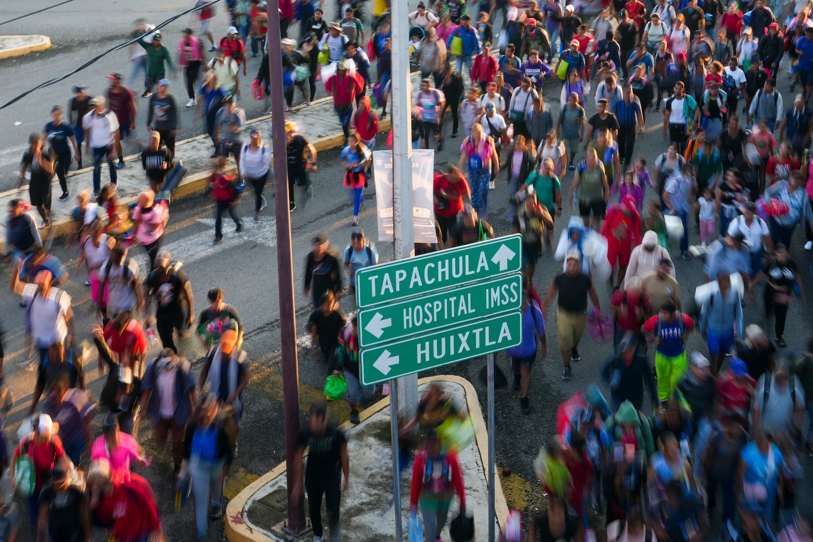 Migrants depart Tapachula, Mexico, hoping to reach the country's northern border and ultimately the United States, Tuesday, Nov. 5, 2024. (AP Photo/Moises Castillo)