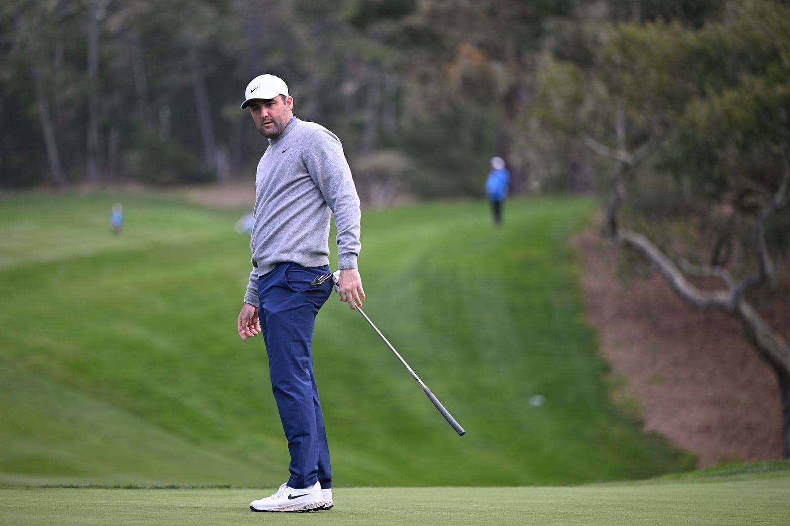 Scottie Scheffler watches his putt on the 13th hole during the first round of the AT&T Pebble Beach Pro-Am golf tournament, Thursday, Jan. 30, 2025, in Pebble Beach, Calif. (AP Photo/Nic Coury)