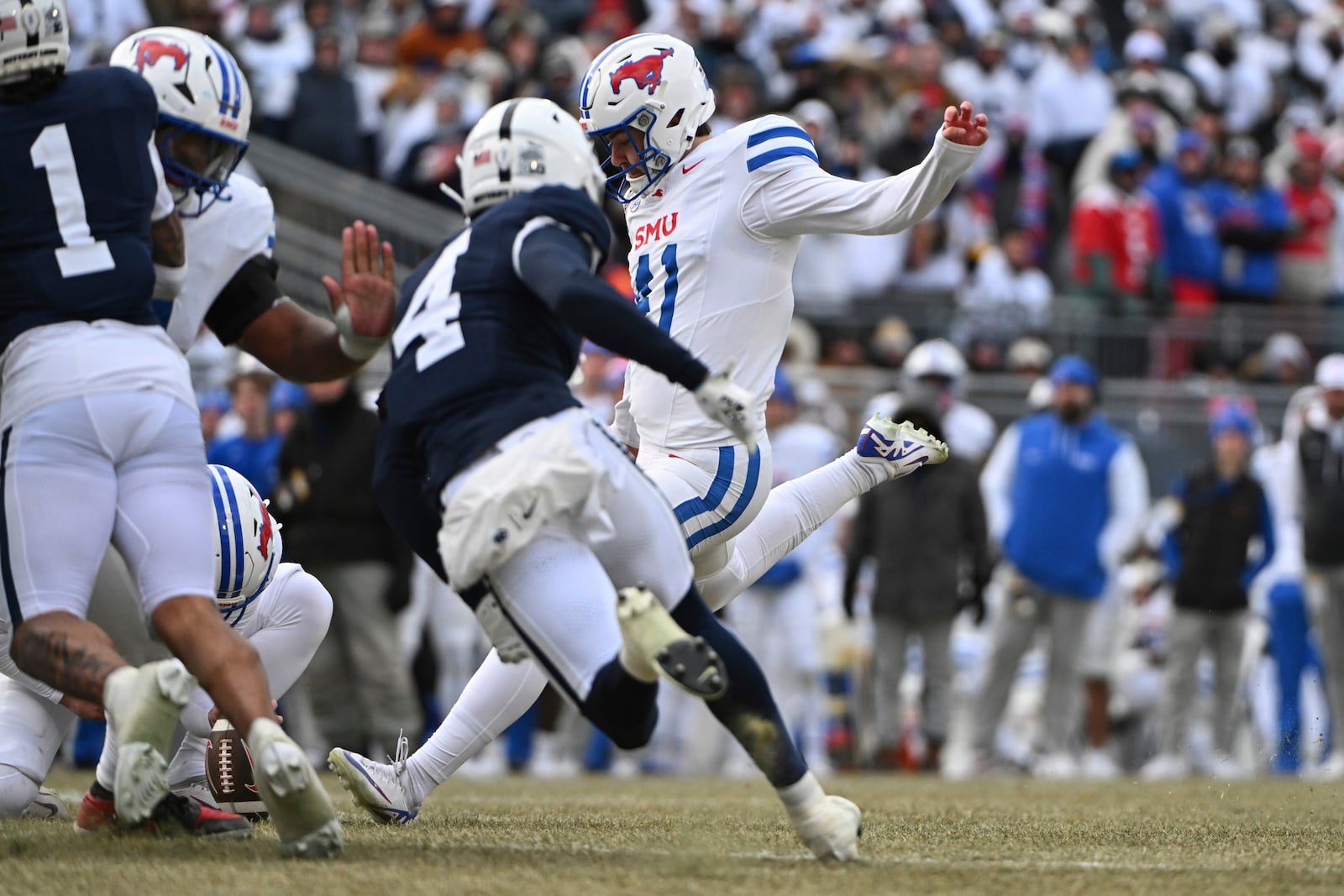 SMU place kicker Collin Rogers (41) kicks a field goal against Penn State during the second half in the first round of the College Football Playoff, Saturday, Dec. 21, 2024, in State College, Pa. (AP Photo/Barry Reeger)