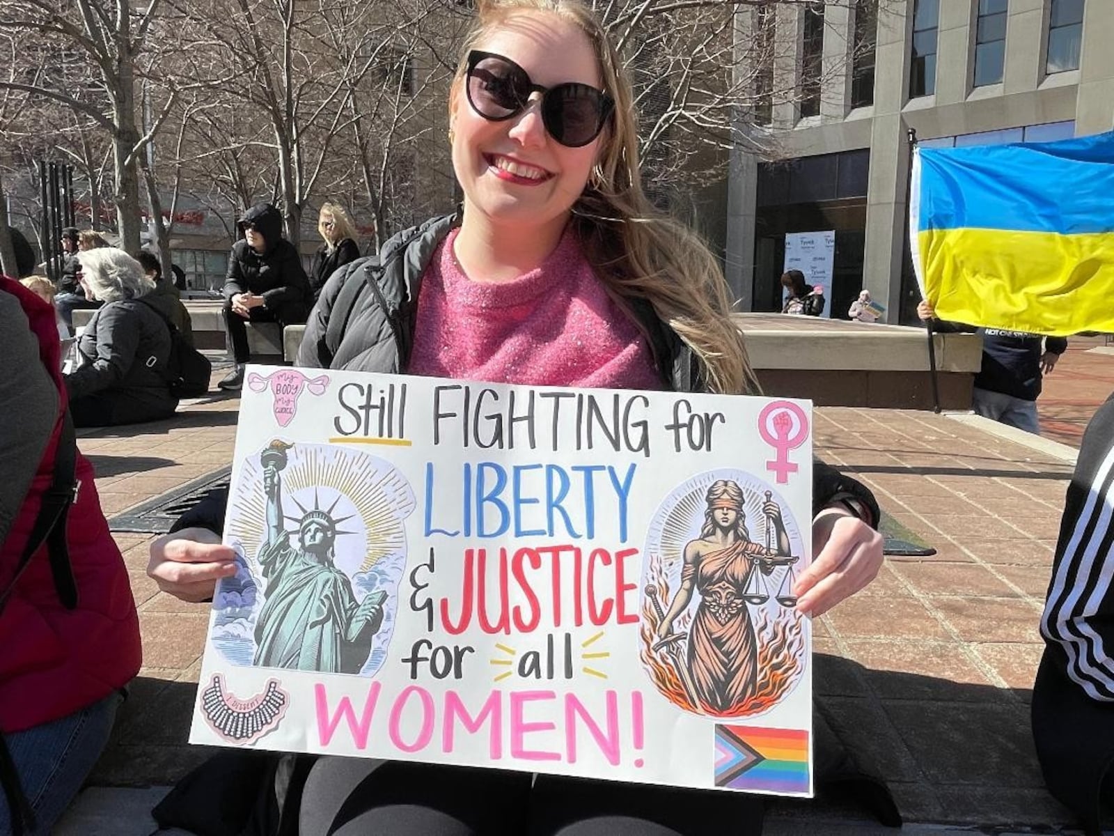 Whitney Johnson attends Dayton rally Saturday, March 8 in celebration of International Women's Day. Photo by Russell Florence Jr.