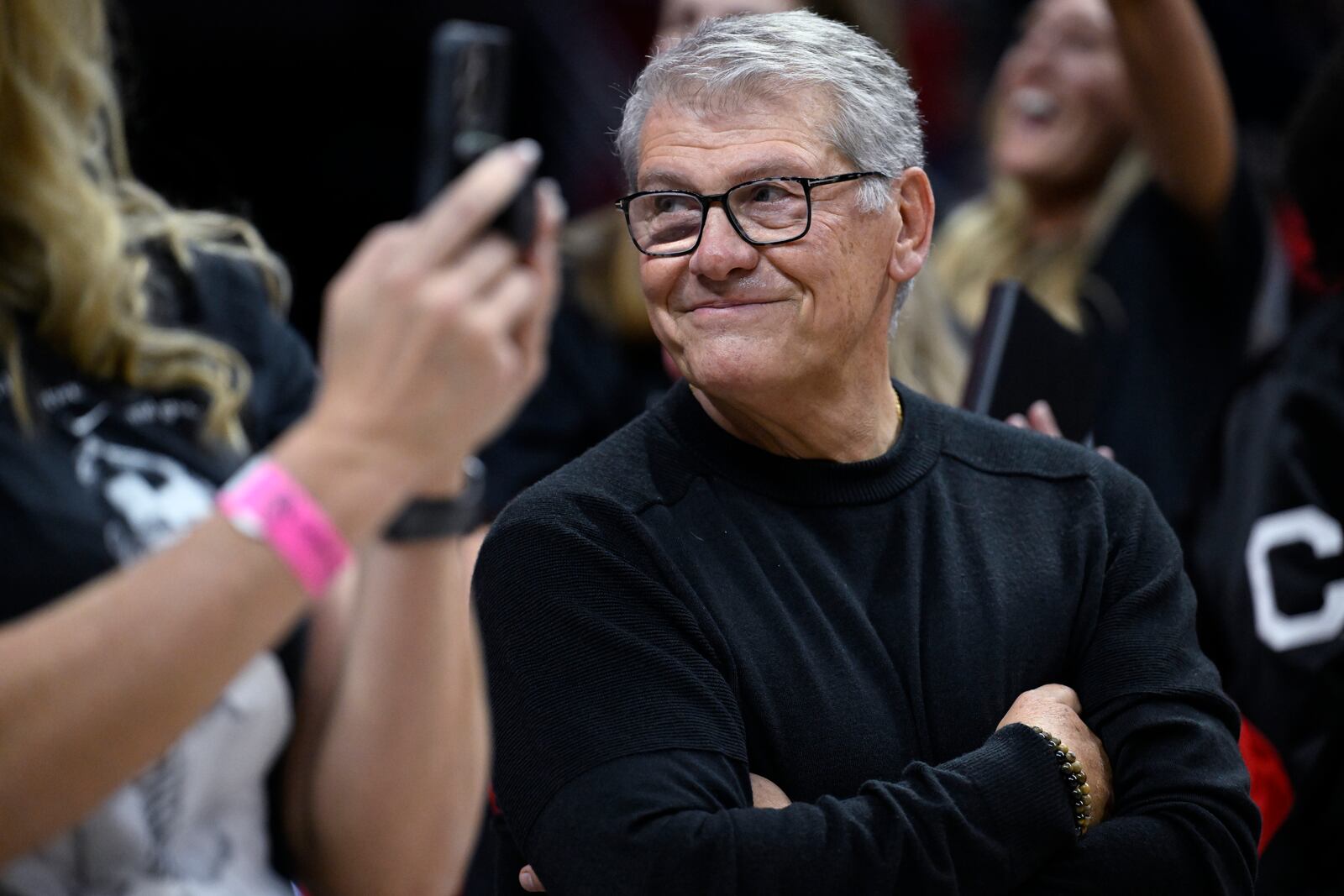 UConn head coach Geno Auriemma smiles as he is honored for the most wins in college basketball history, Wednesday, Nov. 20, 2024, in Storrs, Conn. (AP Photo/Jessica Hill)