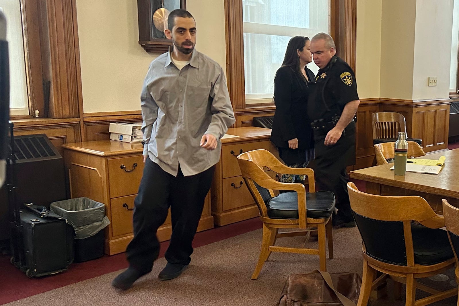 Hadi Matar, accused of repeatedly stabbing Salman Rushdie as the renowned author was being introduced for a lecture in western New York, walks in the courtroom during a break in his attempted murder trial, Wednesday, Feb. 19, 2025, in Chautauqua County Court in Mayville, N.Y. (AP Photo/Carolyn Thompson)