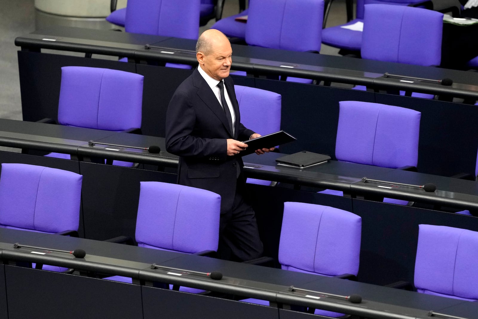 German Chancellor Olaf Scholz attends a plenary session in the German parliament Bundestag in Berlin, Germany, Wednesday, Nov. 13, 2024. (AP Photo/Markus Schreiber)