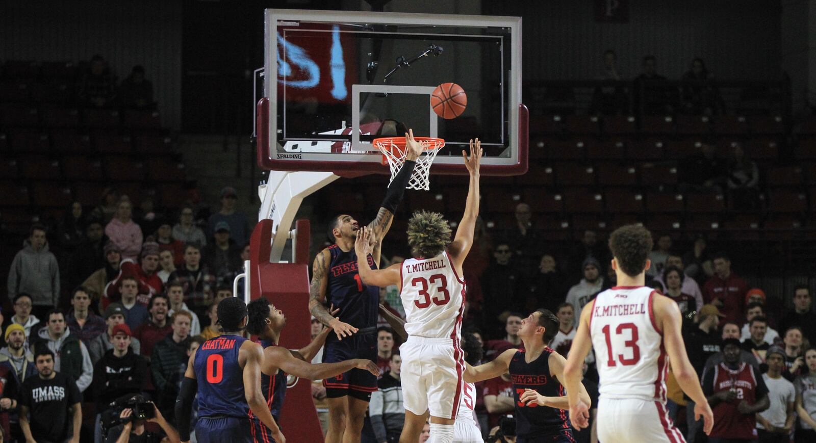 Massachusetts center Tre Mitchell shoots over Dayton’s Obi Toppin in the first half on Saturday, Feb. 15, 2020, at the Mullins Center in Amherst, Mass. David Jablonski/Staff