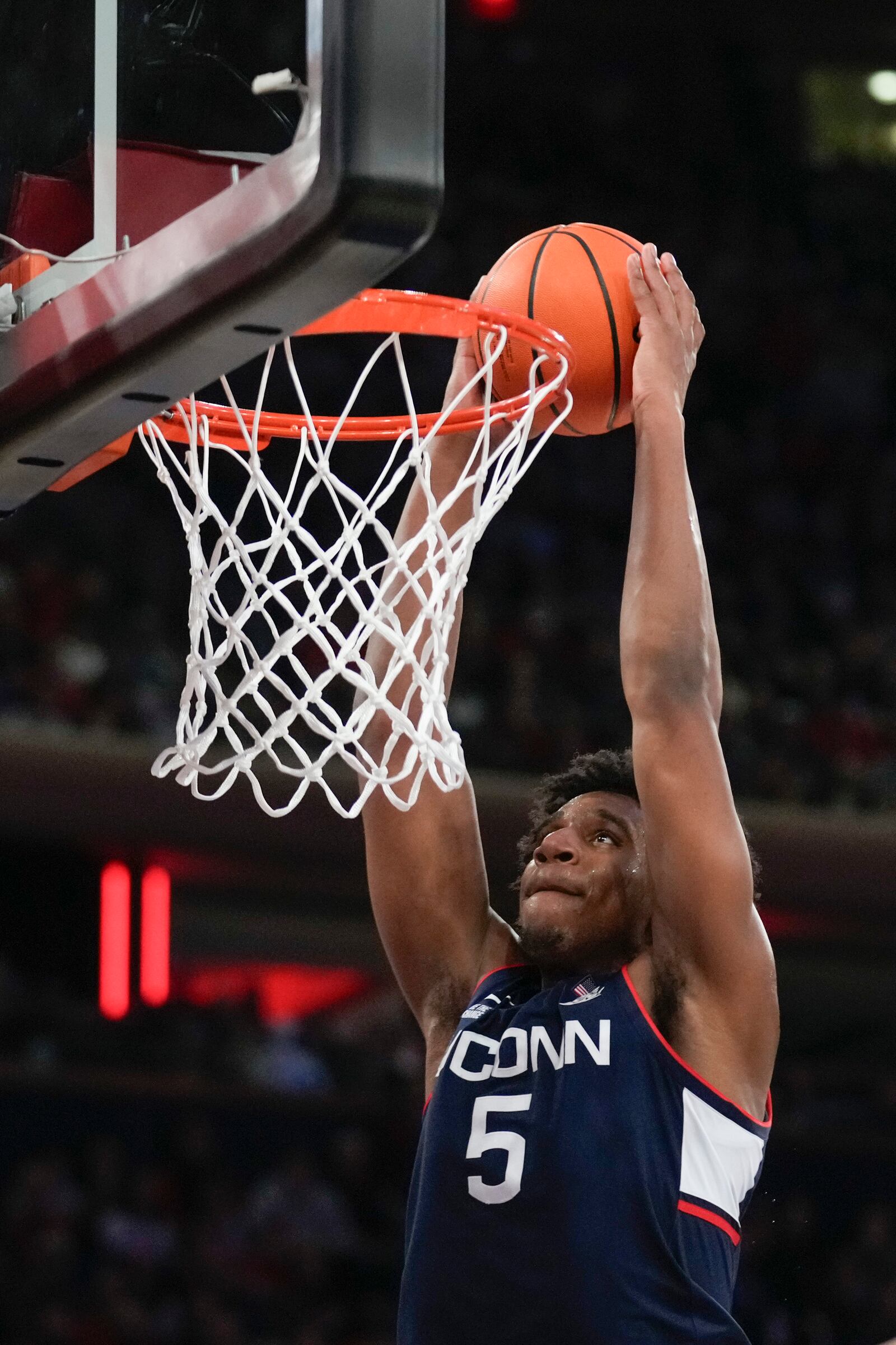 UConn's Tarris Reed Jr. dunks the ball during the first half of an NCAA college basketball game against St. John's, Sunday, Feb. 23, 2025, in New York. (AP Photo/Seth Wenig)