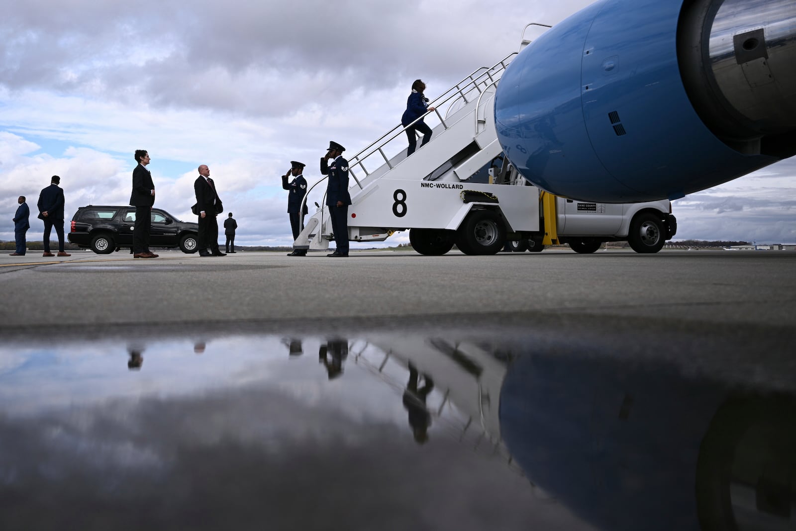 Democratic presidential nominee Vice President Kamala Harris boards Air Force Two before departing Dane County Regional Airport in Madison, Wis., Thursday, Oct. 31, 2024. (Brendan Smialowski/ Pool via AP)