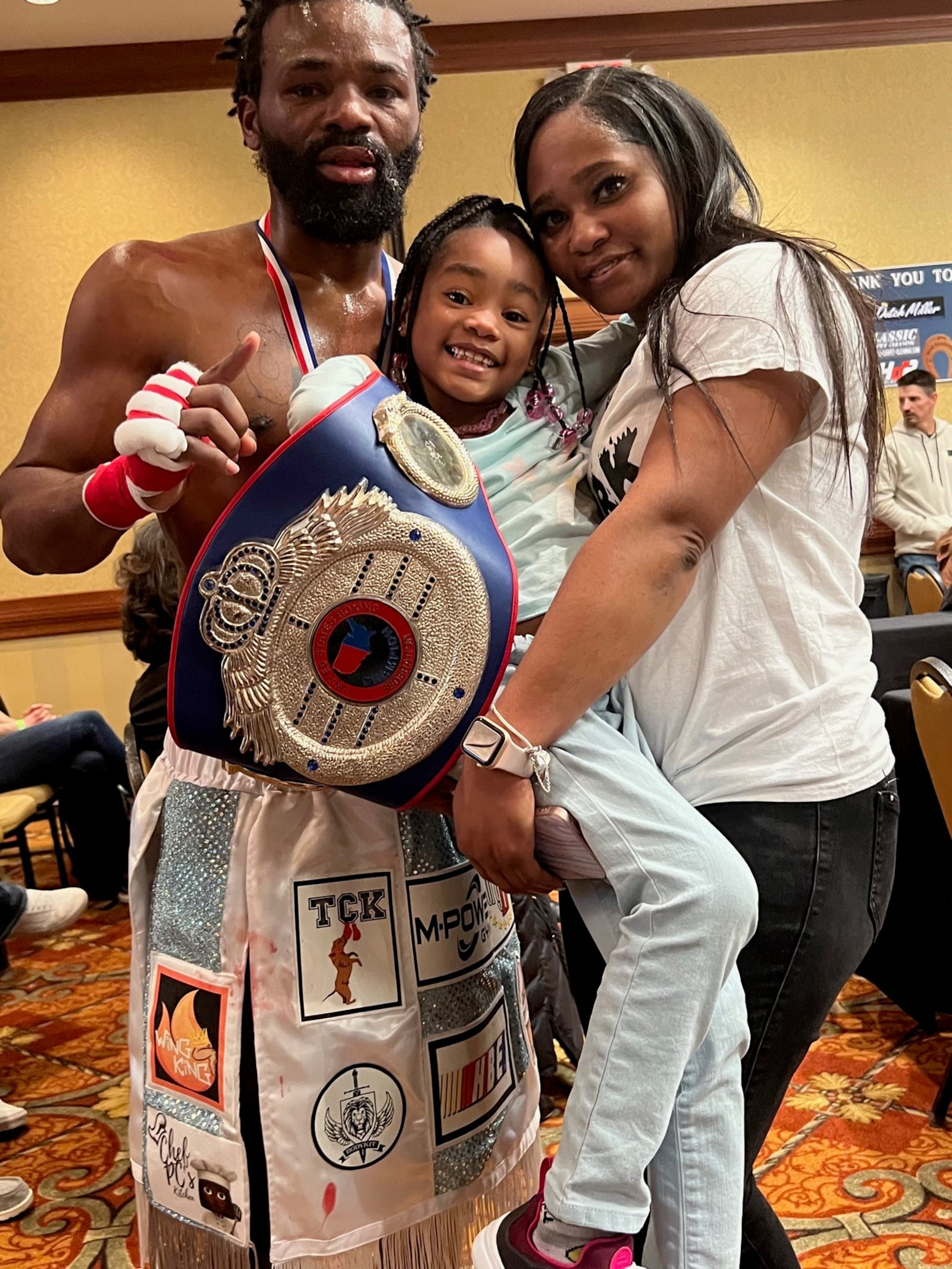 After scoring a sixth round TKO in his first bout since being shot five times and left for dead  17 months ago outside a Dollar General store he worked at on Salem Avenue TKO, Jeff Camp sought out his daughter Ja’Bre and wife Tempestt.  CONTRIBUTED