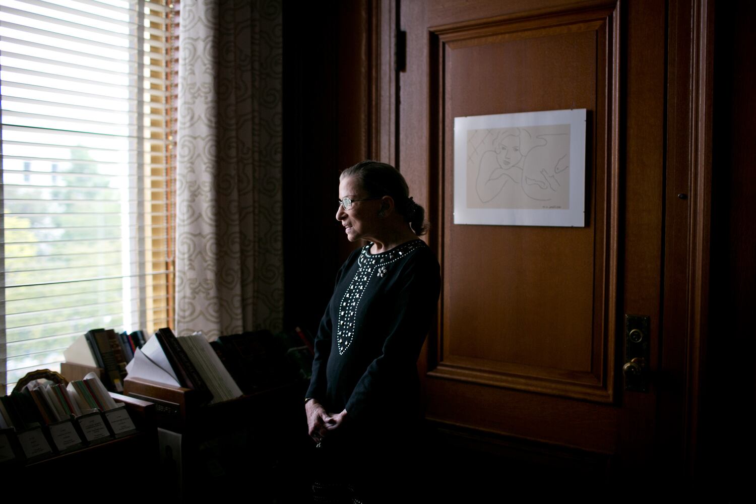 FILE -- Justice Ruth Bader Ginsburg, in her chambers at the Supreme Court in Washington, August 23, 2013. Ginsburg, the second woman to serve on the Supreme Court and a pioneering advocate for women’s rights, who in her ninth decade became a much younger generation’s unlikely cultural icon, died of complications from metastatic pancreas cancer on Friday, Sept. 18, 2020. She was 87.  (Todd Heisler/The New York Times)..