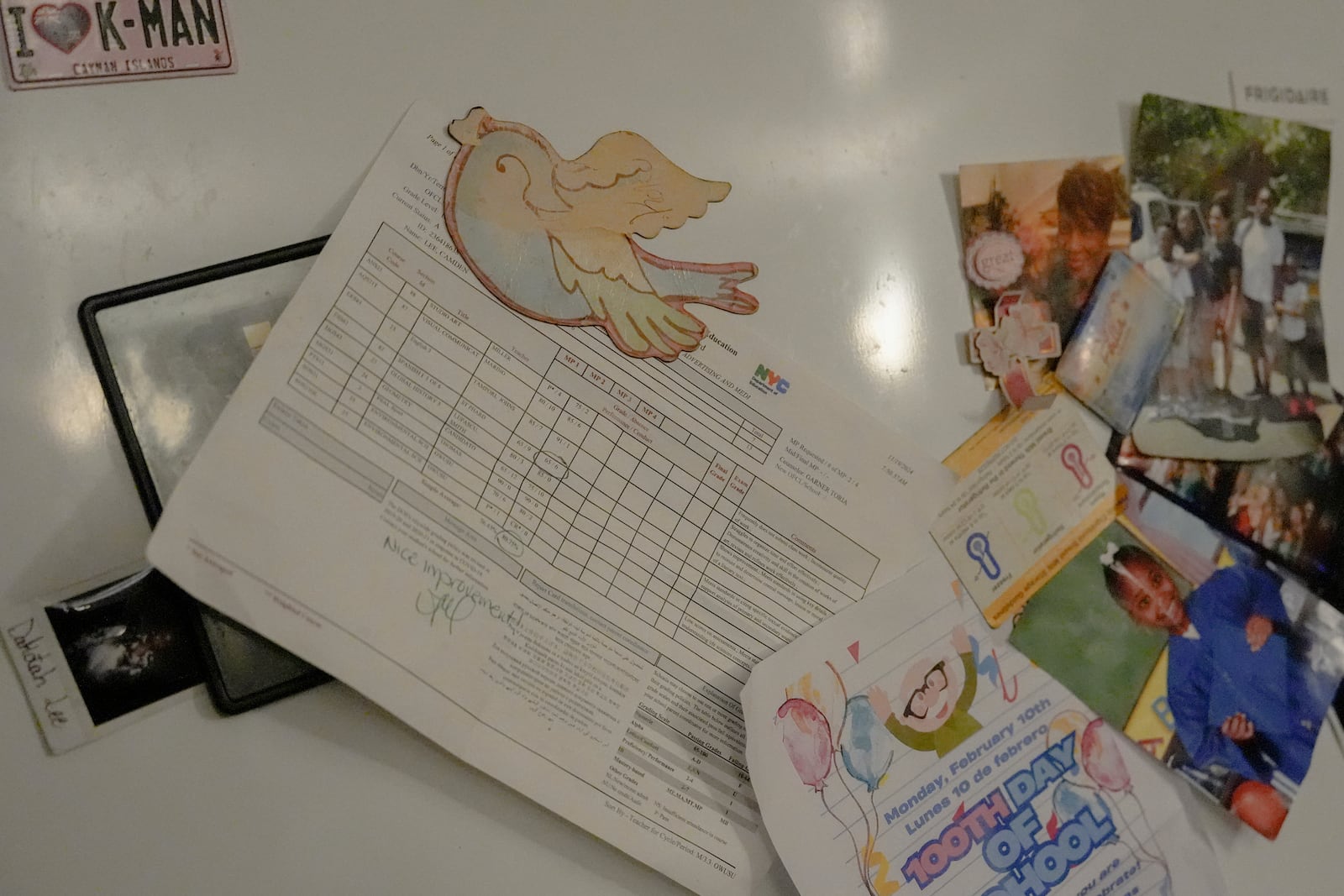 Camden Lee's report card hangs on the refrigerator in his family's apartment, Tuesday, Jan. 28, 2025, in the Brooklyn borough of New York. (AP Photo/Julia Demaree Nikhinson)