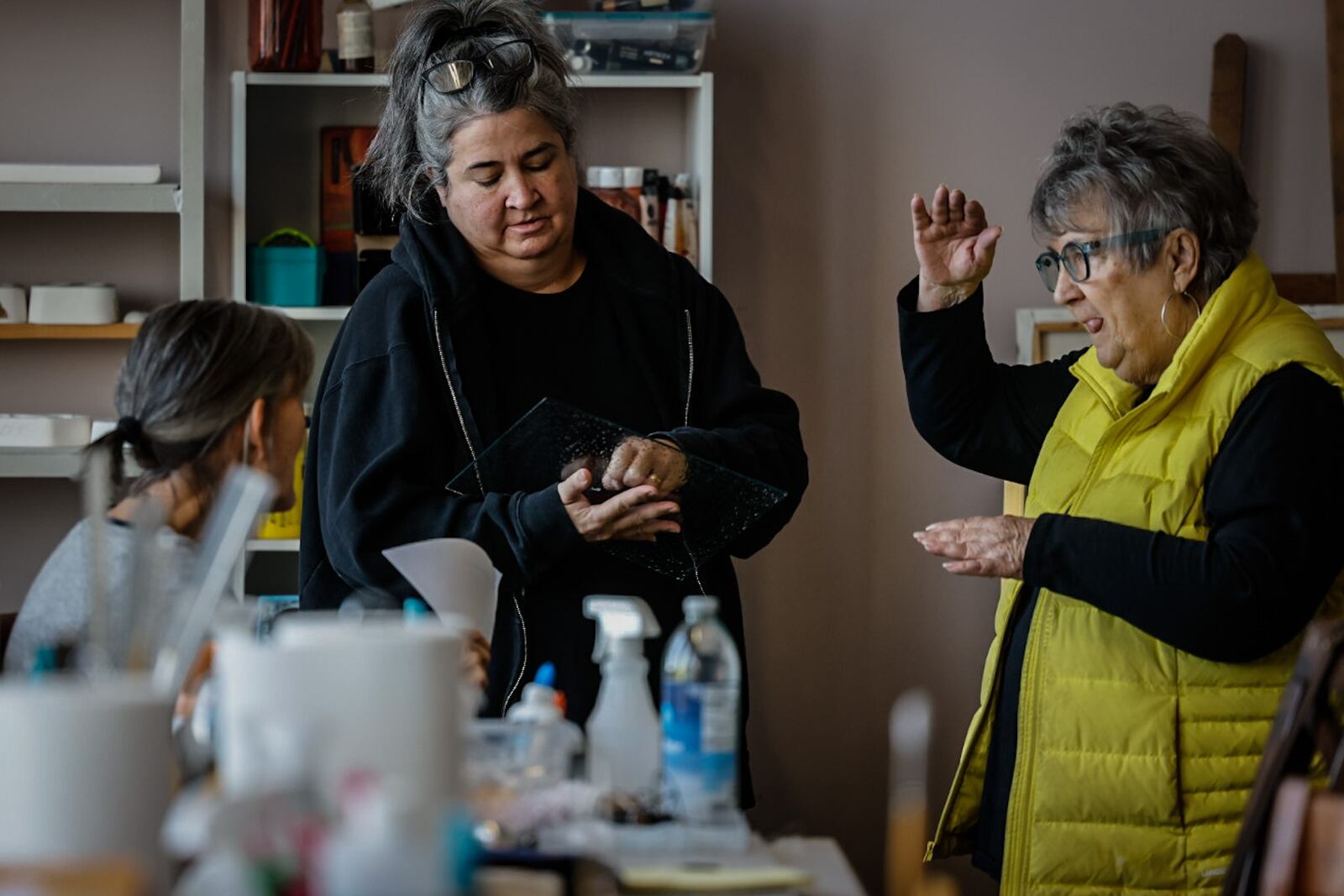 From left, Ellen Ireland, Amy Deal, Esther Kadash work together in a studio at Front Street. JIM NOELKER/STAFF