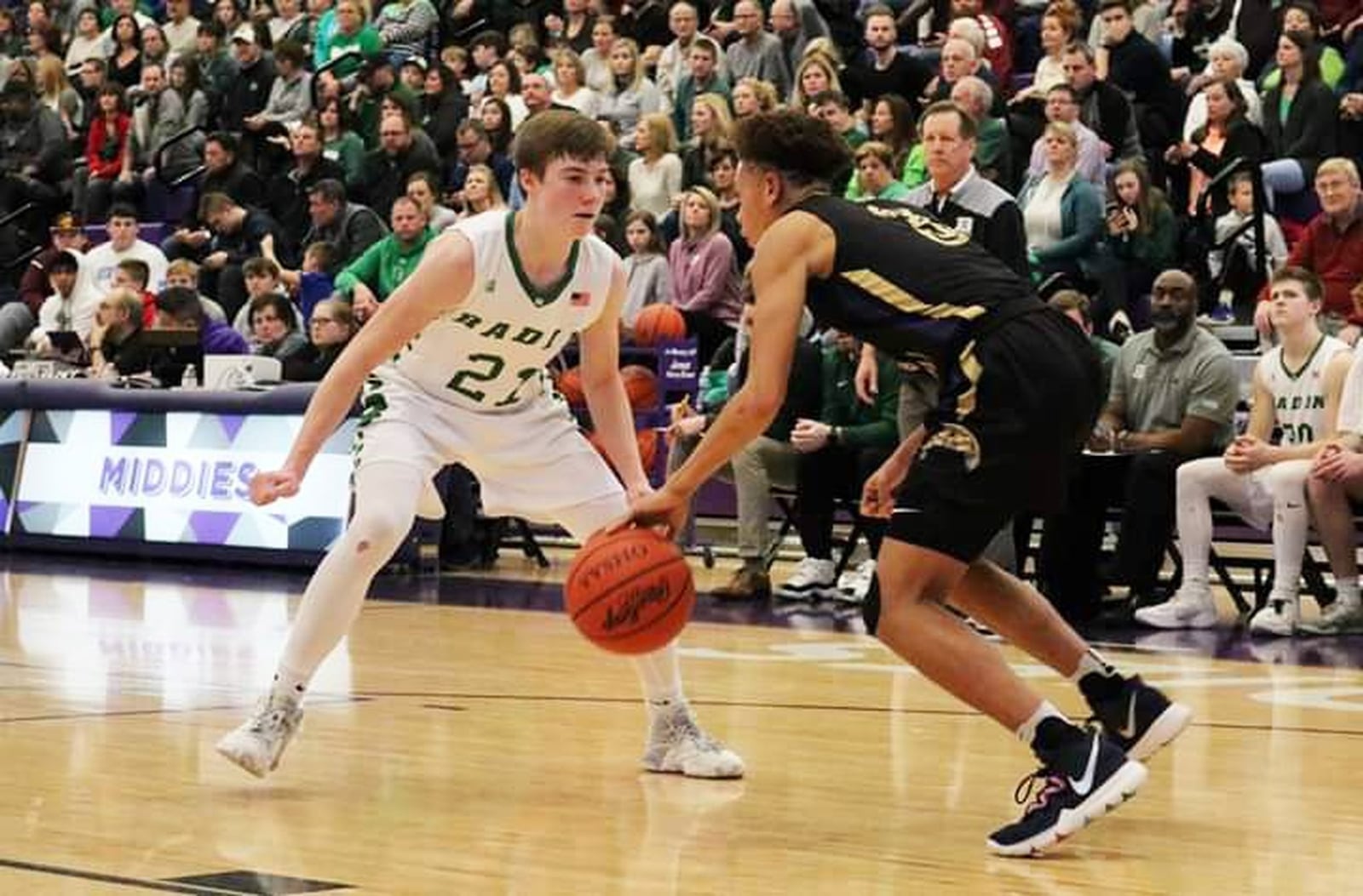 Badin’s Josh Hegemann defends Thurgood Marshall’s Eric Middlebrook during Saturday night’s Division II district semifinal basketball game at Middletown’s Wade E. Miller Arena. Thurgood Marshall won 67-53. CONTRIBUTED PHOTO BY TERRI ADAMS