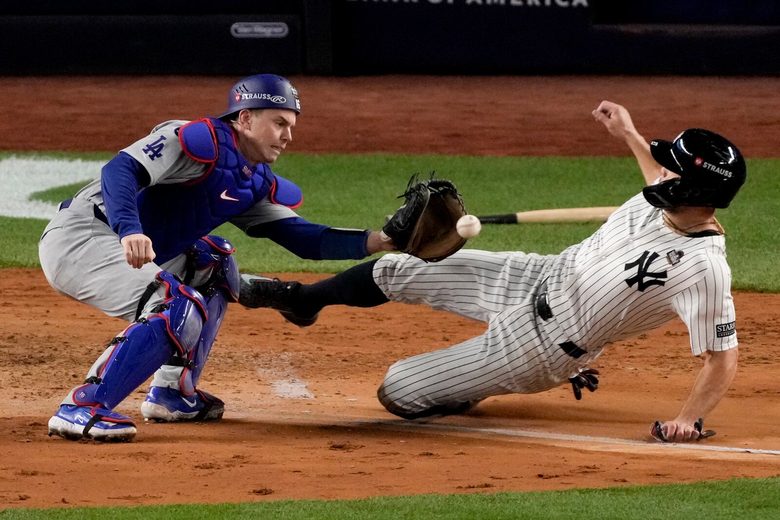 New York Yankees' Giancarlo Stanton is tagged out at home by Los Angeles Dodgers catcher Will Smith during the fourth inning in Game 3 of the baseball World Series, Monday, Oct. 28, 2024, in New York. (AP Photo/Frank Franklin II)