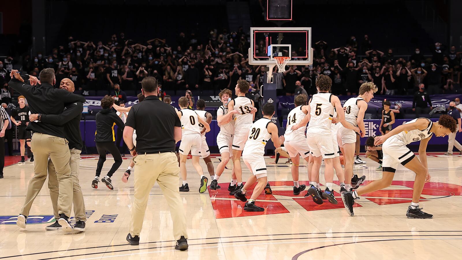 Centerville players celebrate a 43-42 win over Westerville Central in Sunday's Division I state championship game at UD Arena. Michael Cooper/CONTRIBUTED