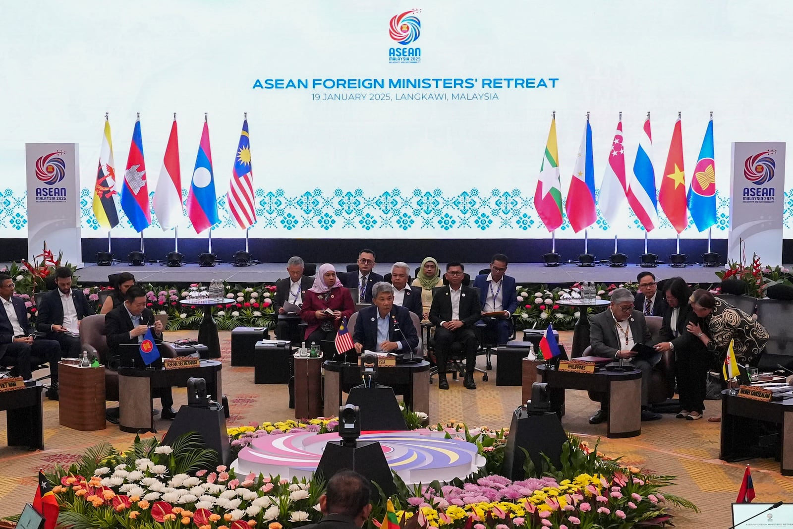 Malaysia's Foreign Minister Mohamad Hasan, center, delivers his speech during the Association of Southeast Asian Nations (ASEAN) Foreign Ministers' Retreat in Langkawi Island, Malaysia, Sunday, Jan. 19, 2025. (AP Photo/Azneal Ishak, Pool)