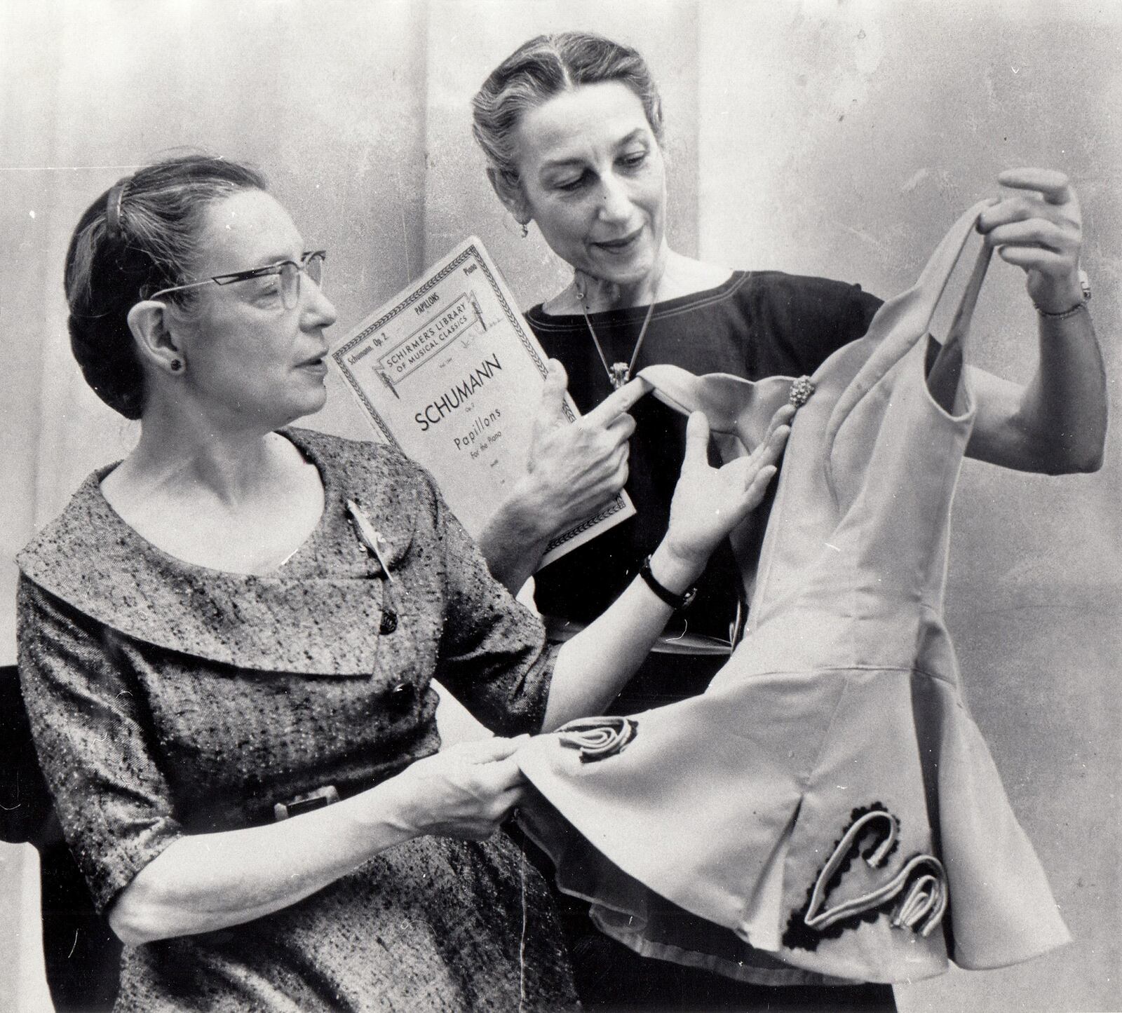 Hermene and Josephine Schwarz look over a costume in a photograph taken in 1962. DAYTON DAILY NEWS ARCHIVE