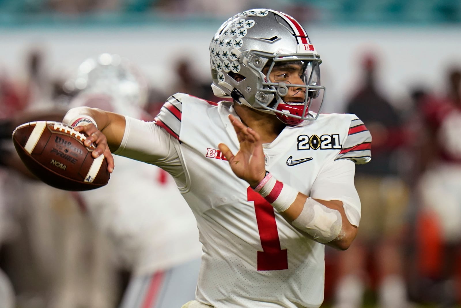 Ohio State quarterback Justin Fields passes against Alabama during the second half of an NCAA College Football Playoff national championship game, Monday, Jan. 11, 2021, in Miami Gardens, Fla. (AP Photo/Chris O'Meara)