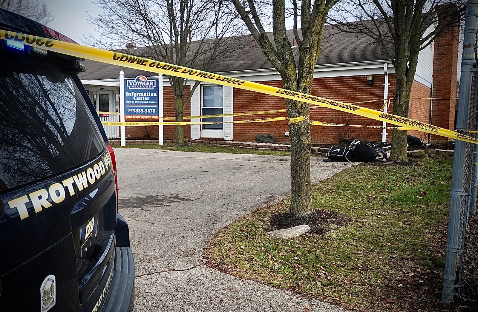  Trotwood police standby at Voyager Village, where a man tried to run over a woman, then pointed a gun at officers that led to a pursuit Monday, January 8, 2024. MARSHALL GORBY \STAFF