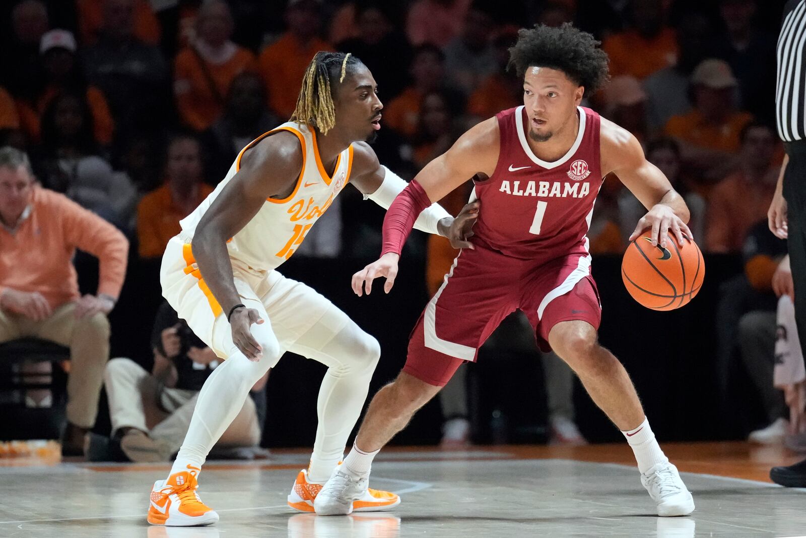 Alabama guard Mark Sears (1) looks for a way around Tennessee's Jahmai Mashack (15) in the first half of an NCAA college basketball game Saturday, March 1, 2025, in Knoxville, Tenn. (AP Photo/Mark Humphrey)