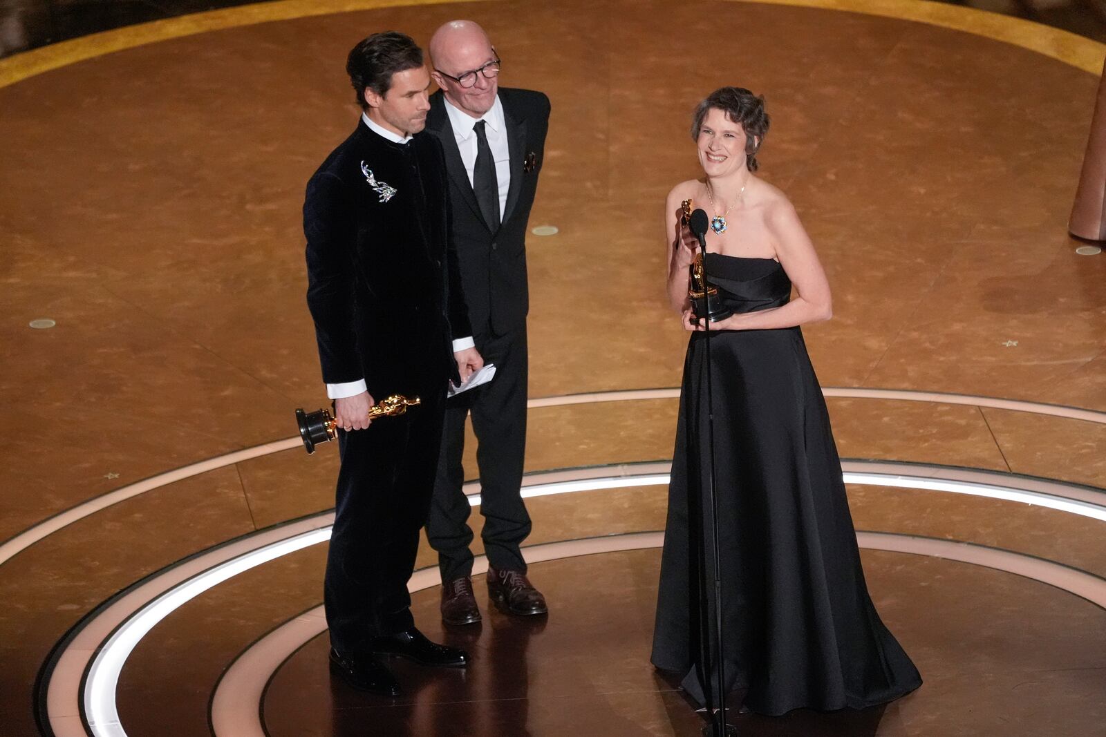 Clement Ducol, from left, Jacques Audiard, and Camille accept the award for best original song for "El Mal" from" Emilia Perez" during the Oscars on Sunday, March 2, 2025, at the Dolby Theatre in Los Angeles. (AP Photo/Chris Pizzello)