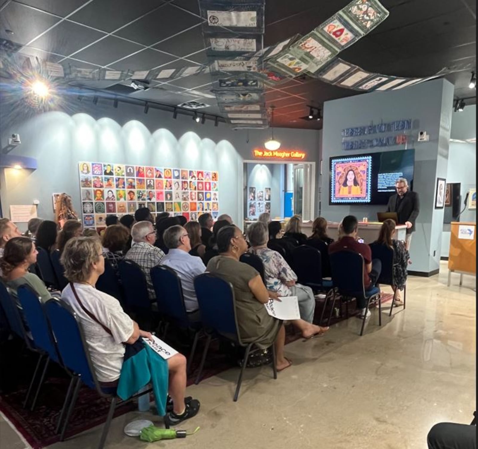 Johnny Selman of Brooklyn, New York, unveils the Project Peace Post exhibit at the International Peace Museum on Friday, Sept. 6. CONTRIBUTED