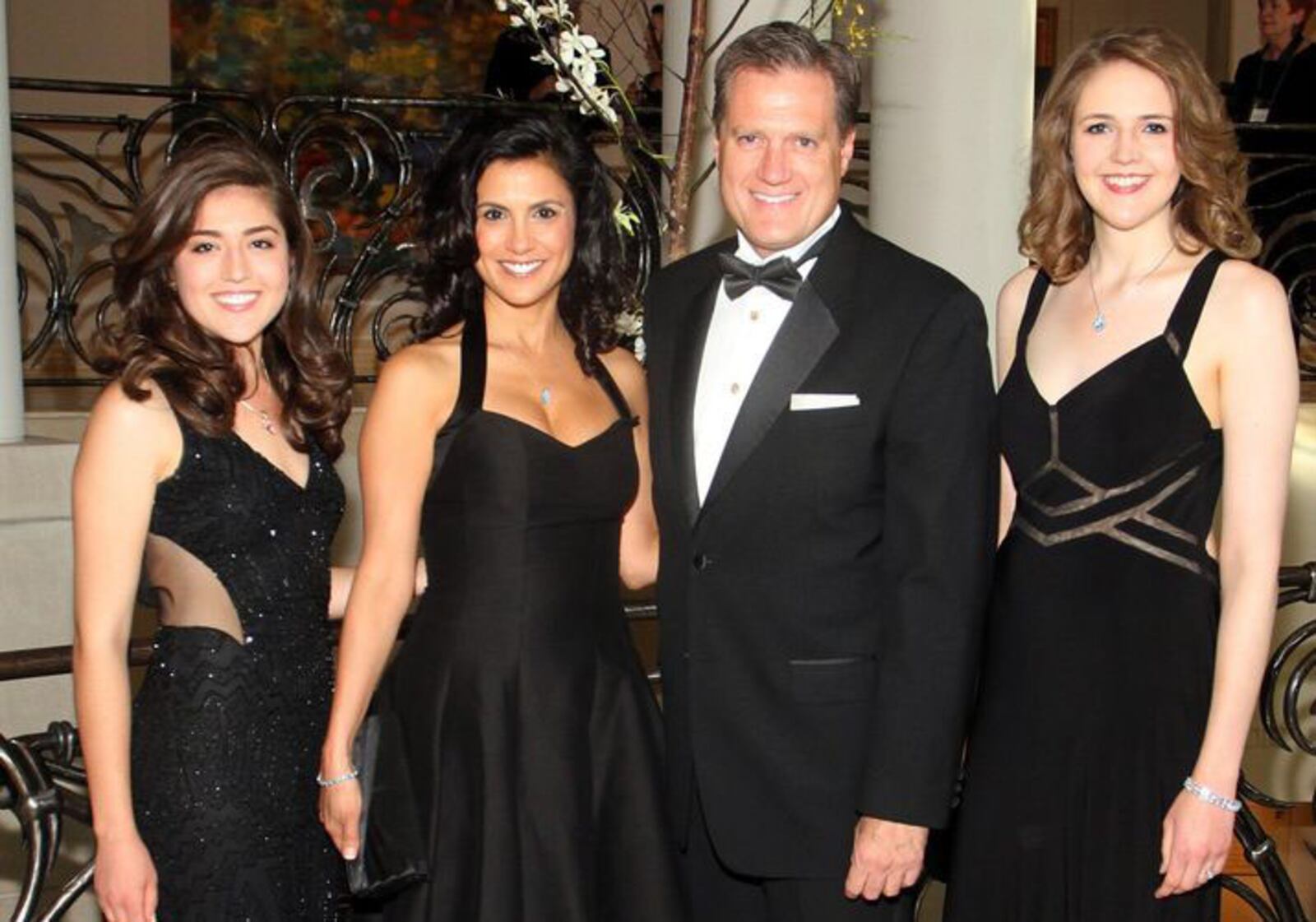 Congressman Mike Turner poses for a photo with his fiancee, Majida Mourad, and his daughters Carolyn, left, and Jessica at the Dayton Art Institute’s Art Ball 2015 on June 13.