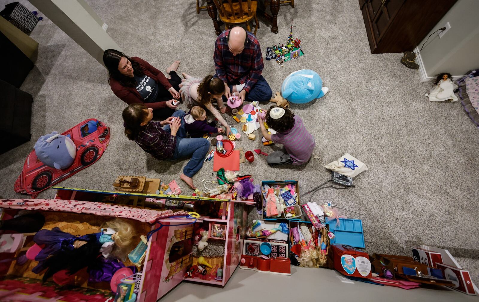 Marcie Sherman's parents, Julie and Philip Goldstein, moved from Florida to live with their daughter's family during the pandemic. They decided to stay and built a house in Miamisburg. JIM NOELKER/STAFF