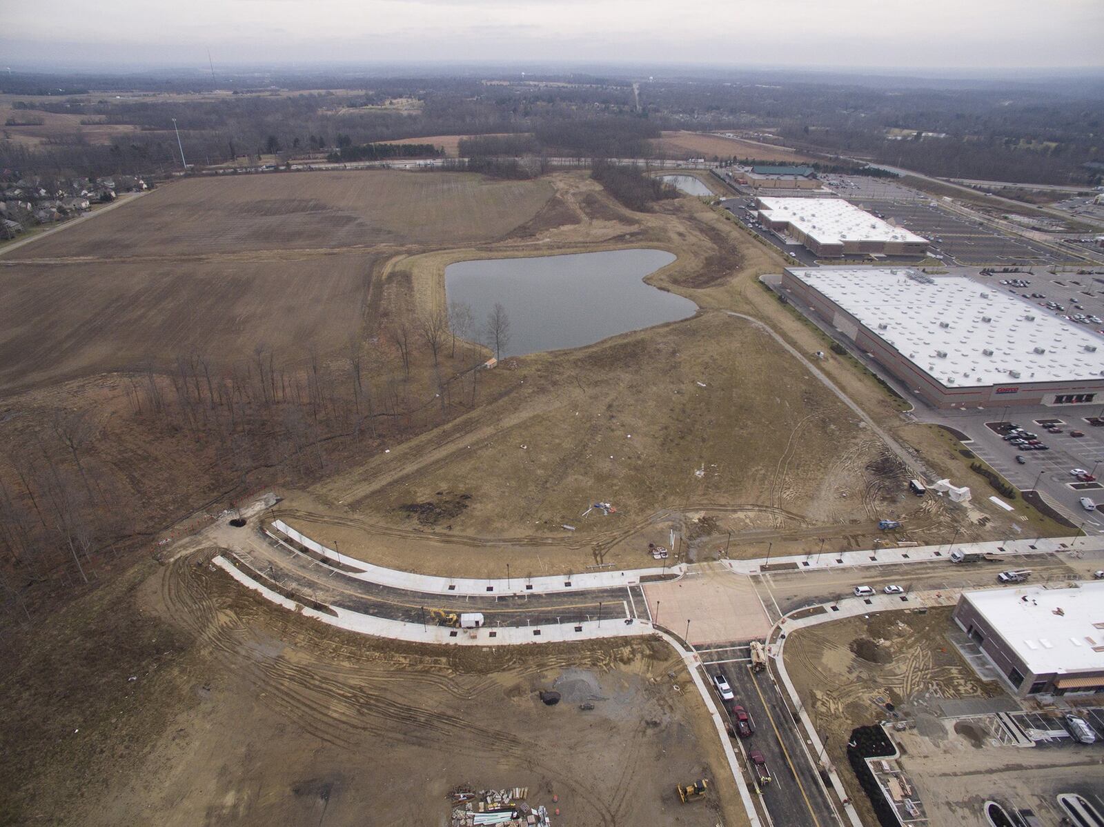 Development of Cornerstone continues in Centerville with new phases along Wilmington Pike and the completion of the Kroger store. This land will include housing. This view is looking east from Wilmington Pike. TY GREENLEES / STAFF