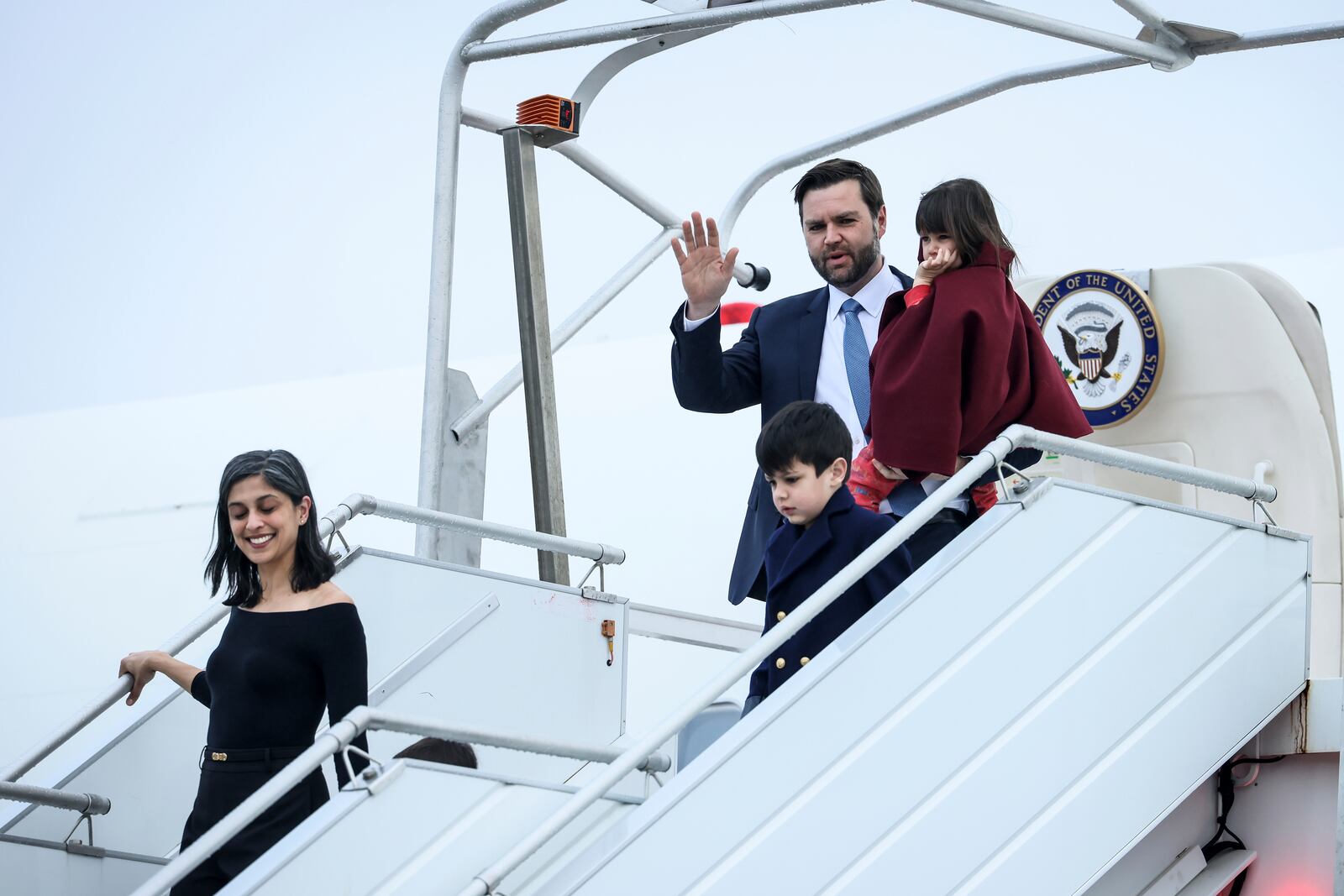 United States Vice-President JD Vance carries his daughter Mirabel as he arrives at Paris Orly Airport, ahead of an Artificial Intelligence Action Summit taking place in Paris, Monday, Feb. 10, 2025. (AP Photo/Thomas Padilla)