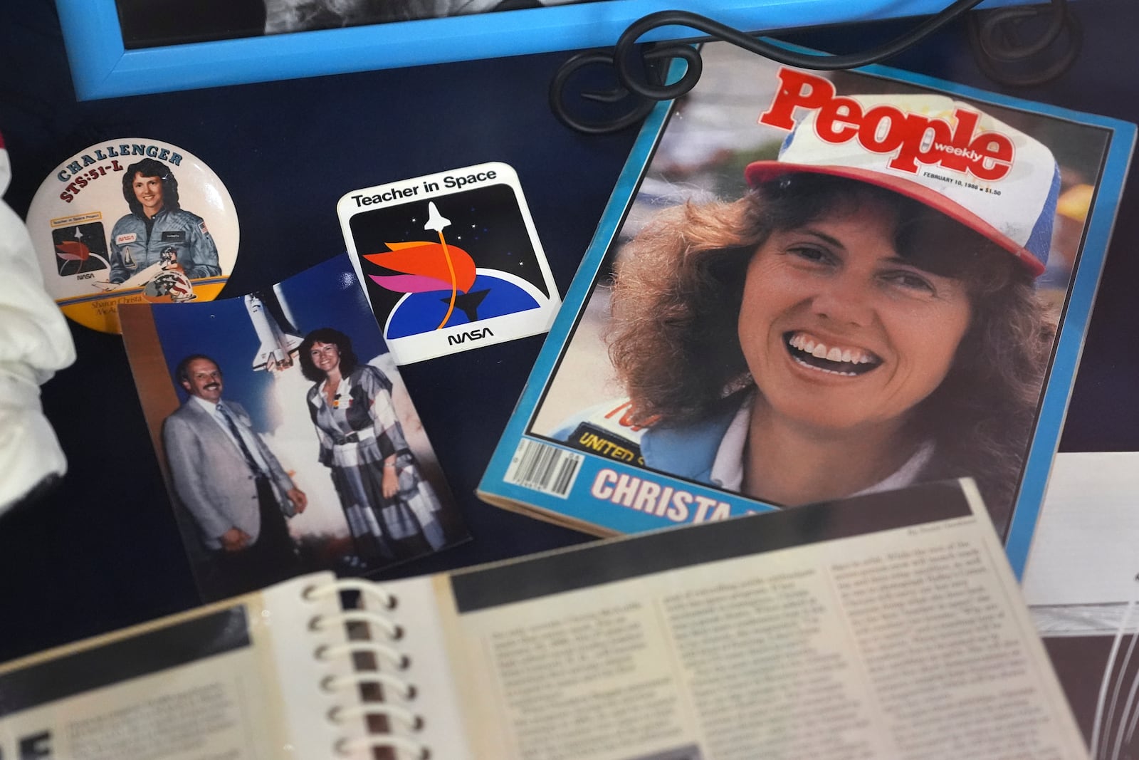 A selection of memorabilia featuring Christa McAuliffe, NASA's first teacher in space, is displayed at the McAuliffe-Shepard Discovery Center, Monday, Dec. 16, 2024, in Concord, N.H. (AP Photo/Charles Krupa)