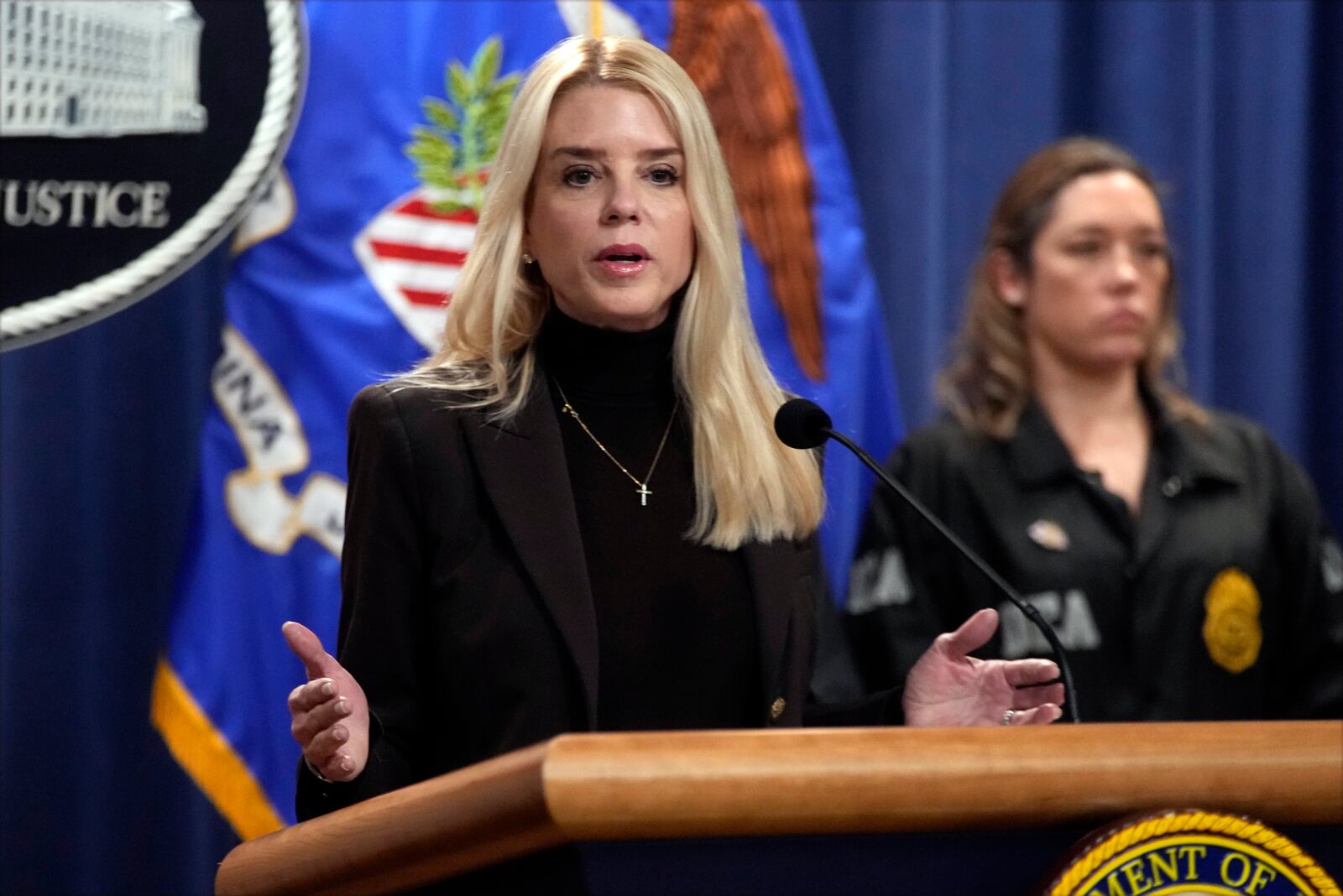 Attorney General Pam Bondi speaks at a news conference regarding immigration enforcement at the Justice Department, Wednesday, Feb. 12, 2025, in Washington. (AP Photo/Ben Curtis)