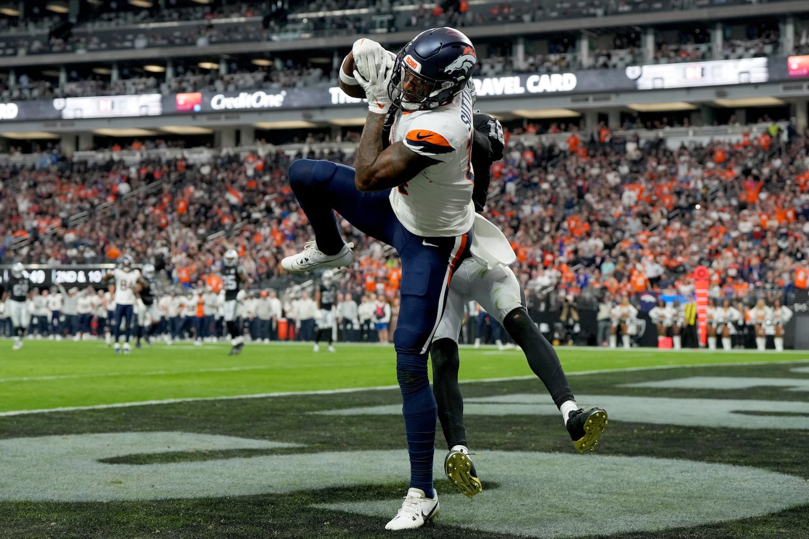 Denver Broncos wide receiver Courtland Sutton (14) pulls in a touchdown pass against the Las Vegas Raiders during the second half of an NFL football game, Sunday, Nov. 24, 2024, in Las Vegas. (AP Photo/Rick Scuteri)