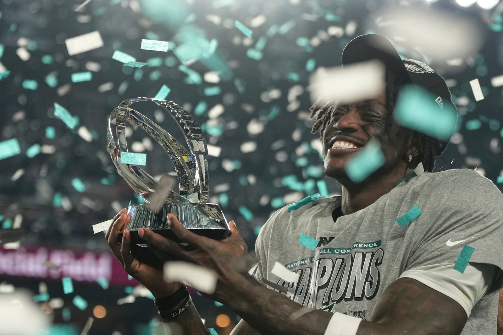 Philadelphia Eagles wide receiver A.J. Brown holds the championship trophy after the Eagles won the NFC Championship NFL football game against the Washington Commanders, Sunday, Jan. 26, 2025, in Philadelphia. (AP Photo/Matt Slocum)