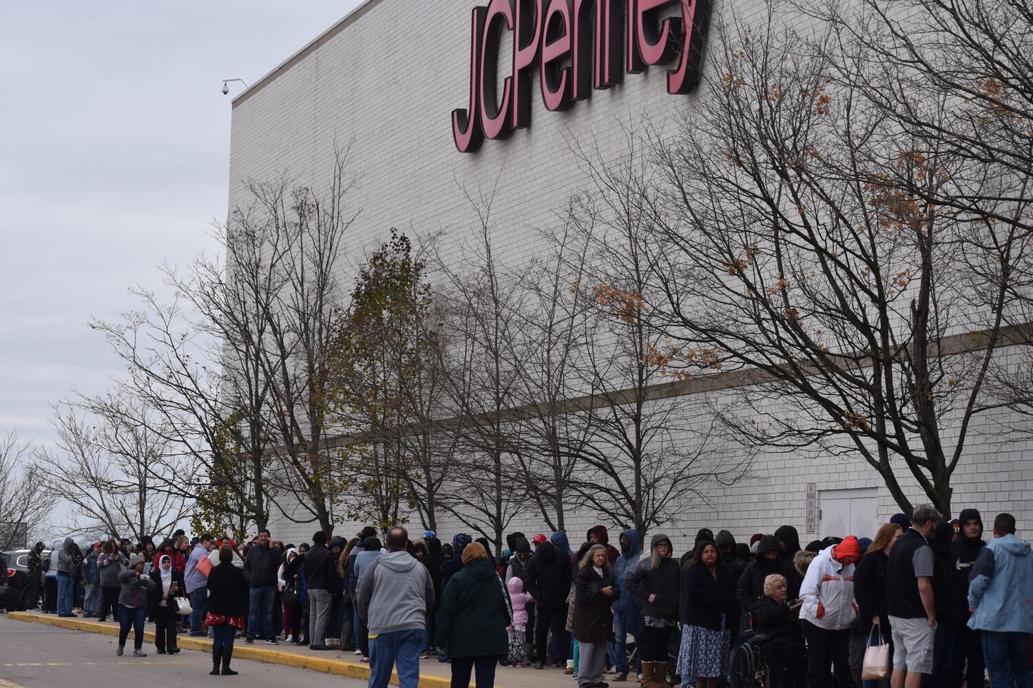 PHOTOS: Hundreds like up outside JCPenney for doorbusters, coupons