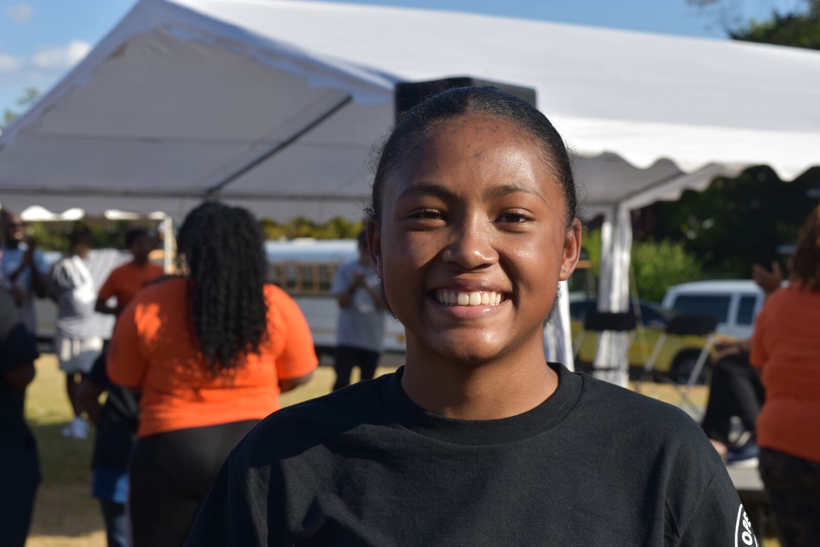 A’Mariyana Bennett, 14, a sophomore at Thurgood Marshall high school, gave a speech at a peace rally in northwest Dayton on Sept. 19, 2024. CORNELIUS FROLIK / STAFF