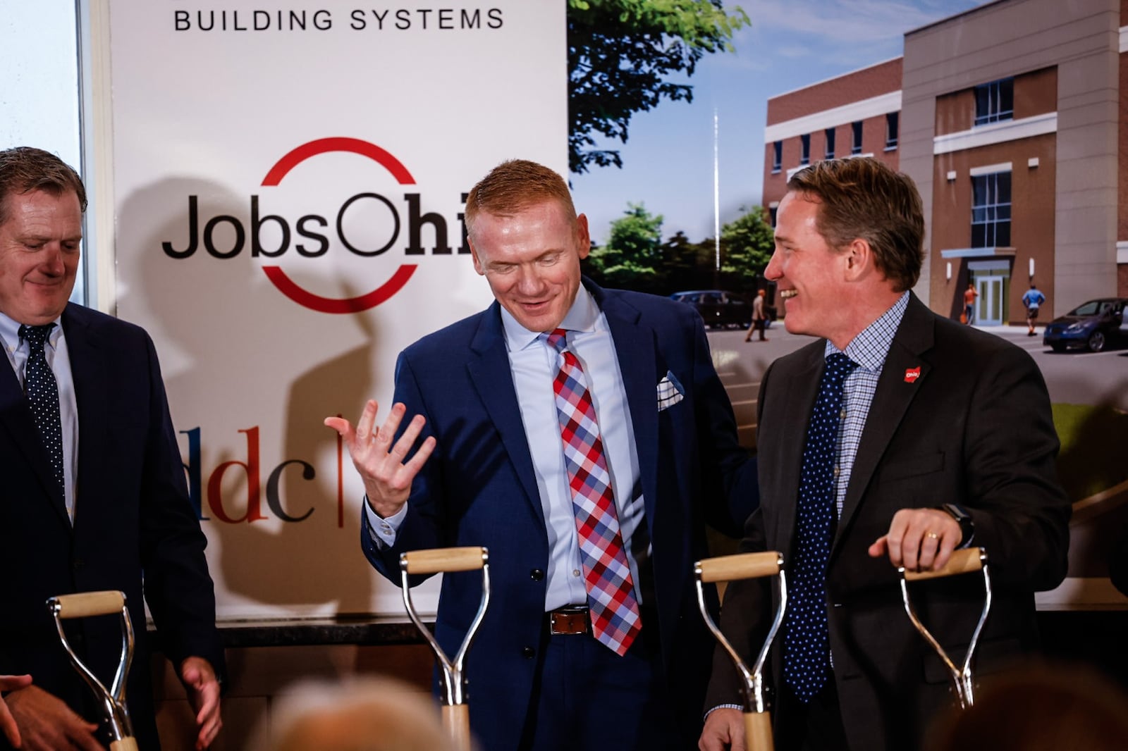 From left, U.S. Rep. Mike Turner; Jerad Barnett, president and CEO of Synergy Building Systems; and Ohio Lt. Governor, Jon Husted celebrate the groundbreaking of a new office development for defense contractors Friday March 3, 2023. The new $19 million office building will be off Colonel Glenn Highway in Beavercreek.  JIM NOELKER/STAFF