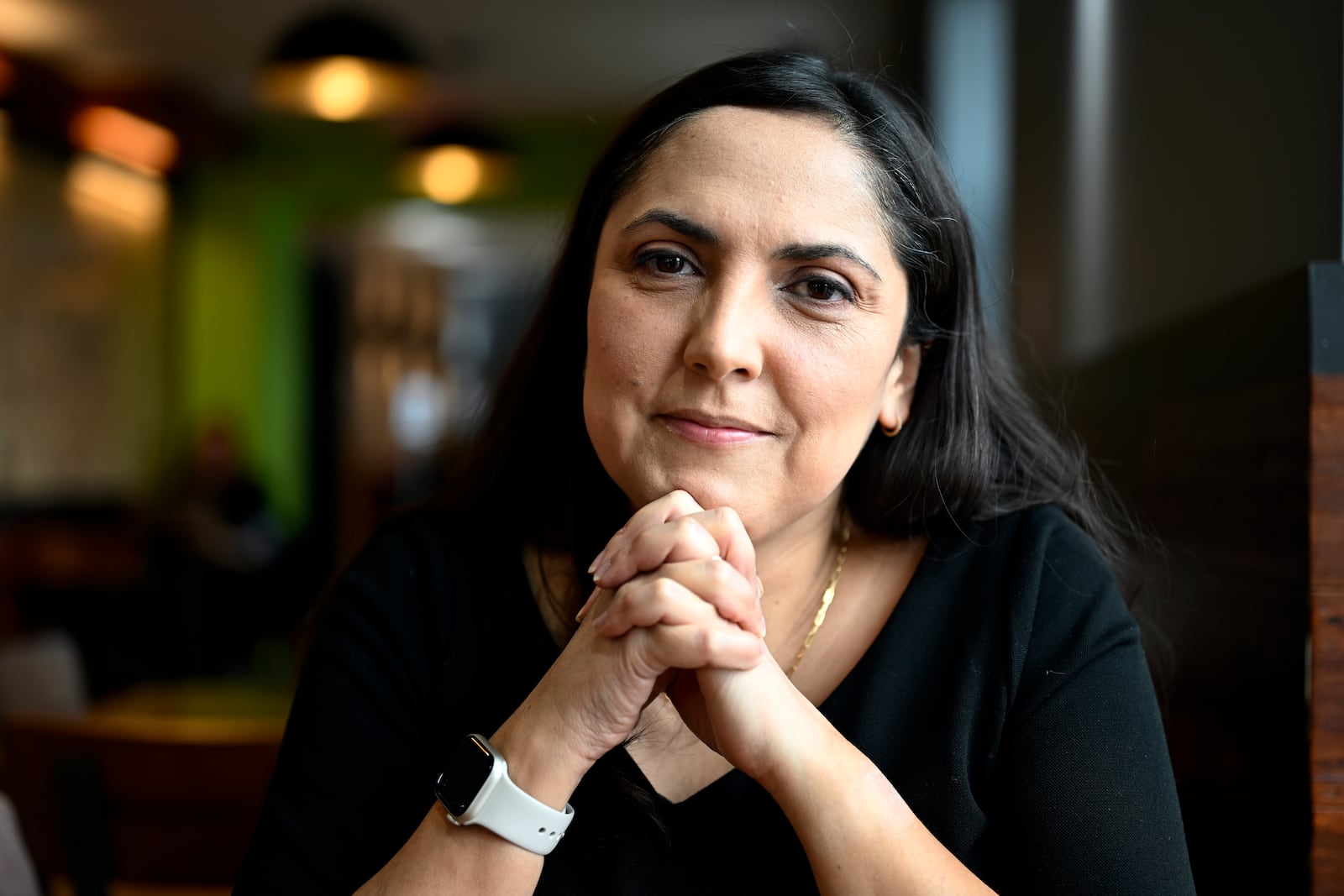 Jenn Kauffman, a semi-finalist for the 2025 Presidential Management Fellows program that was canceled due to budget cuts by DOGE sits in her neighborhood cafe on Thursday, March. 6, 2025, in Washington. (AP Photo/John McDonnell)